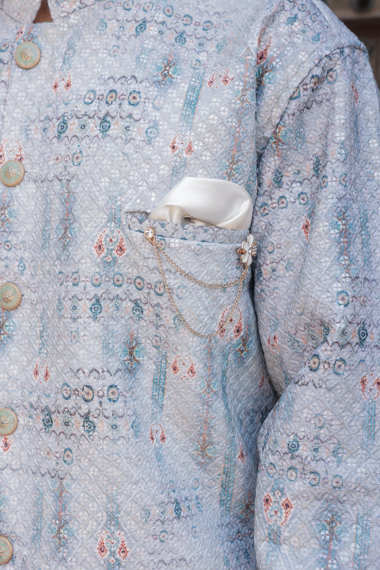 Men's light blue kurta with patterns paired with white churidar, mandarin collar, side pockets, full sleeves - premium Indian formal wear for weddings and special occasion