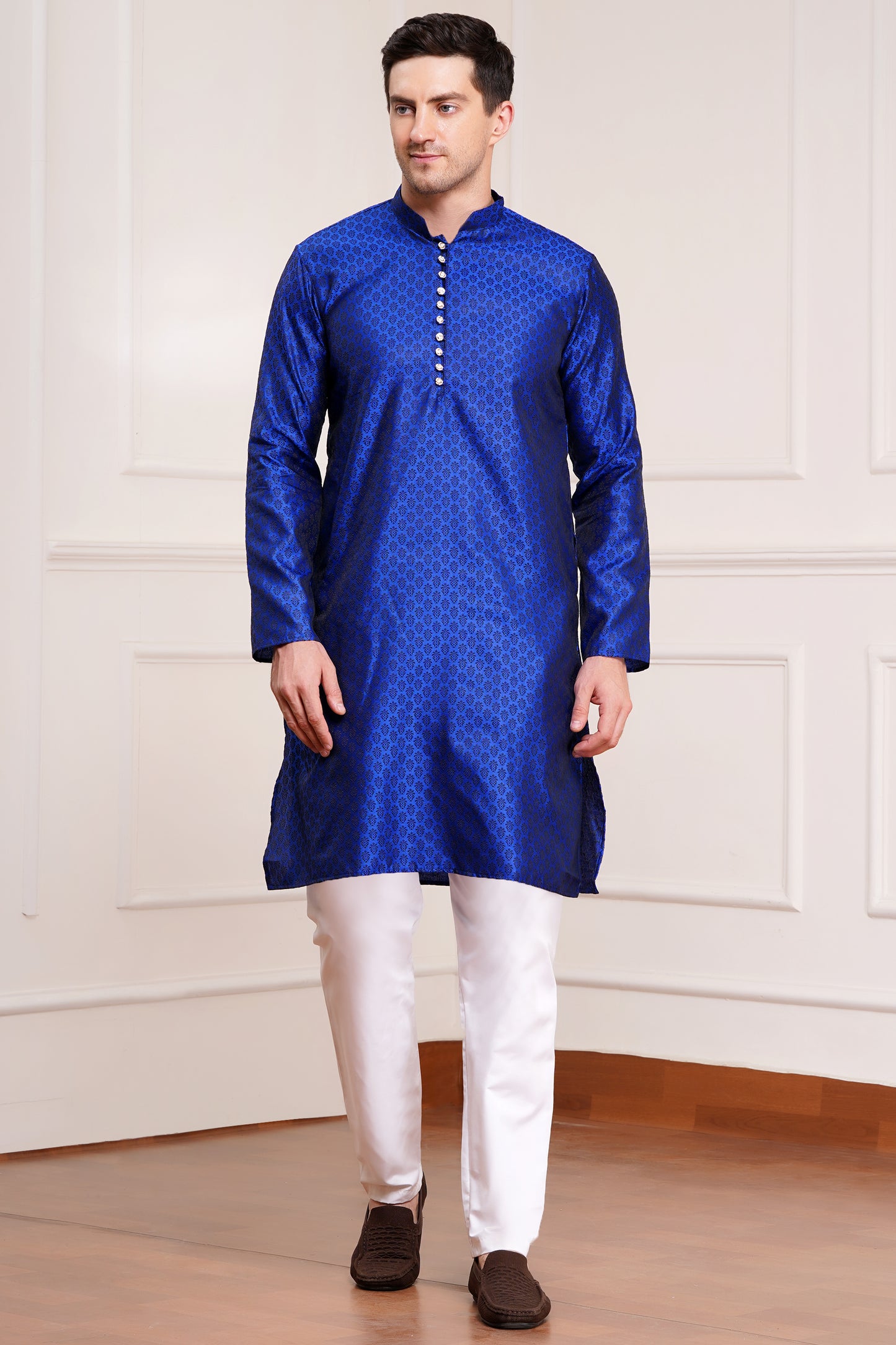 Men's bright blue silk kurta with gold brocade diamond pattern and white churidar pants, decorative buttons with loop closure, mandarin collar, full sleeves, side pockets - traditional Indian festive wear
