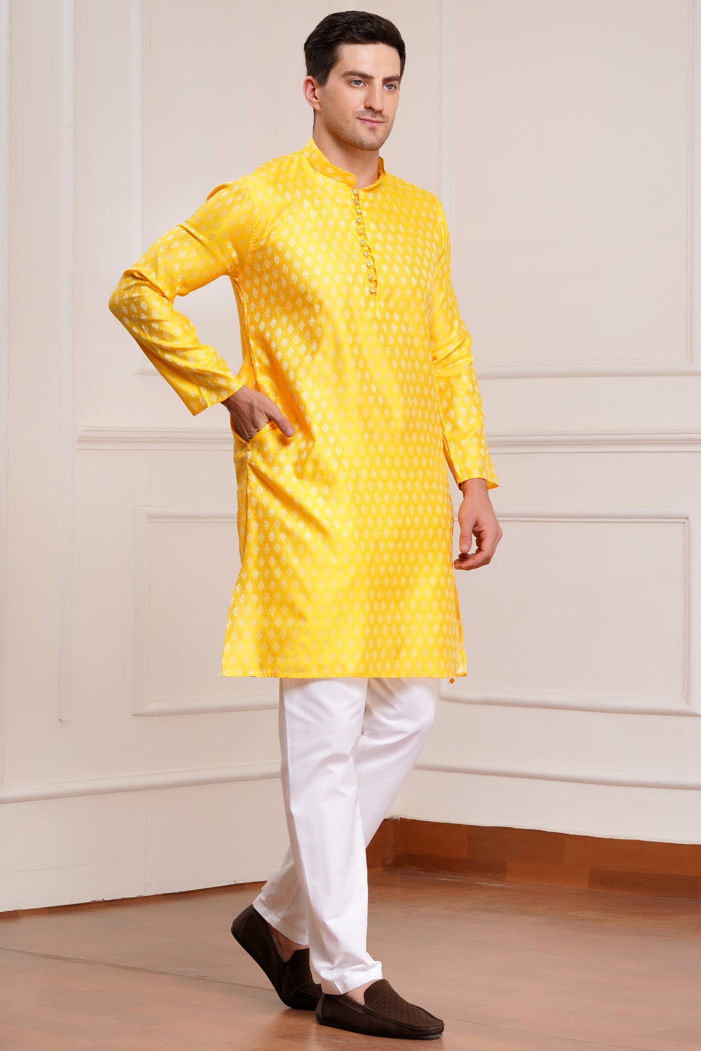 Men's bright yellow silk kurta with gold brocade diamond pattern and white churidar pants, decorative buttons with loop closure, mandarin collar, full sleeves, side pockets - traditional Indian festive wear
