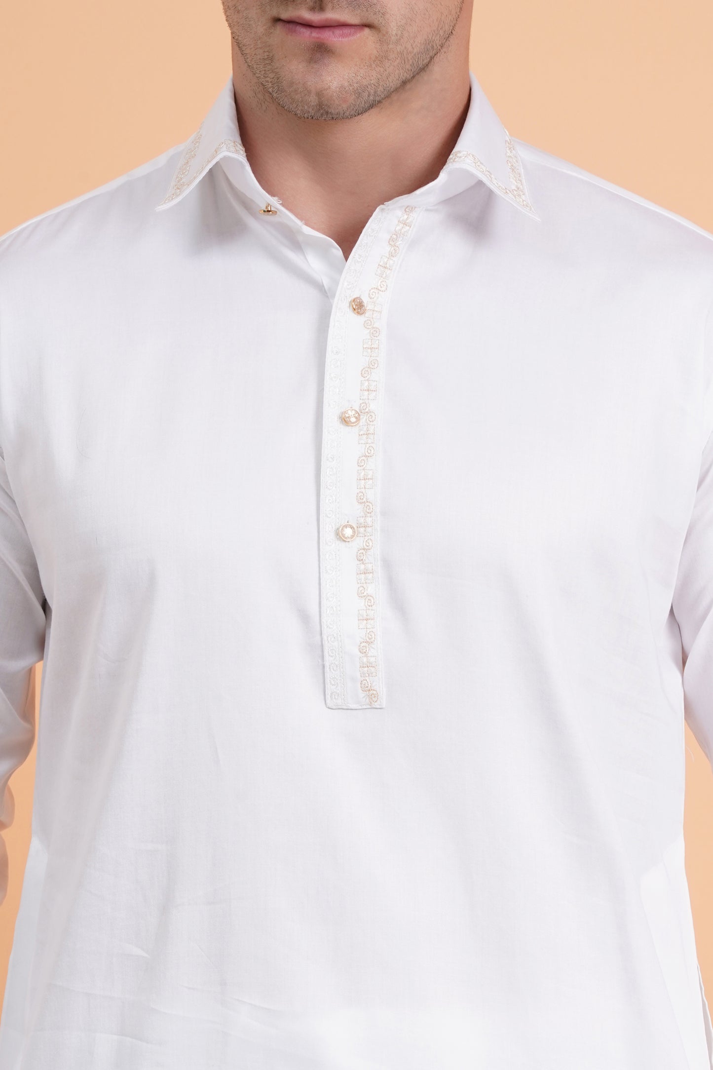 Men white Pathani suit set with knee-length kurta and matching trousers, embroidery around placket and cuffs, shirt collar, button closure, front and side pockets, full sleeves with cuff button closure - traditional casual and festive ethnic wear