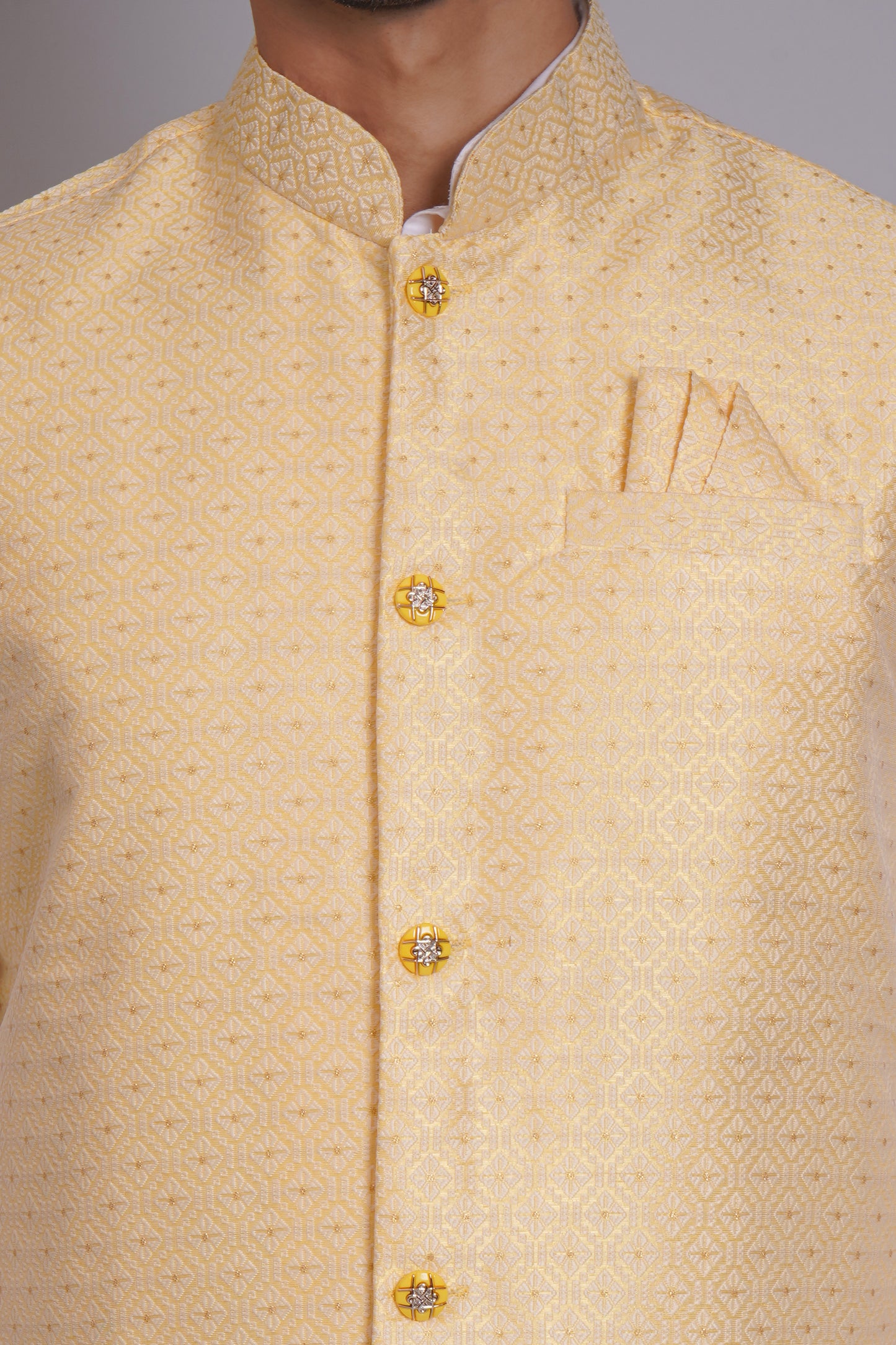 Men's light yellow cotton Nehru jacket with subtle self-print pattern, gold buttons, and mandarin collar - perfect for casual and festive occasions