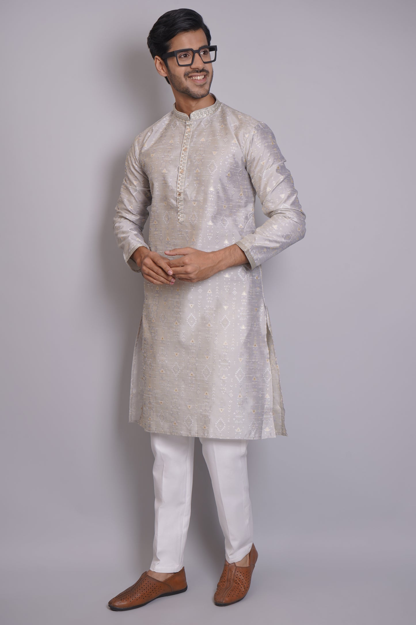 Men's gray cotton kurta with intricate Self print and mandarin collar paired with white pajama, ideal for festive occasions and social gatherings