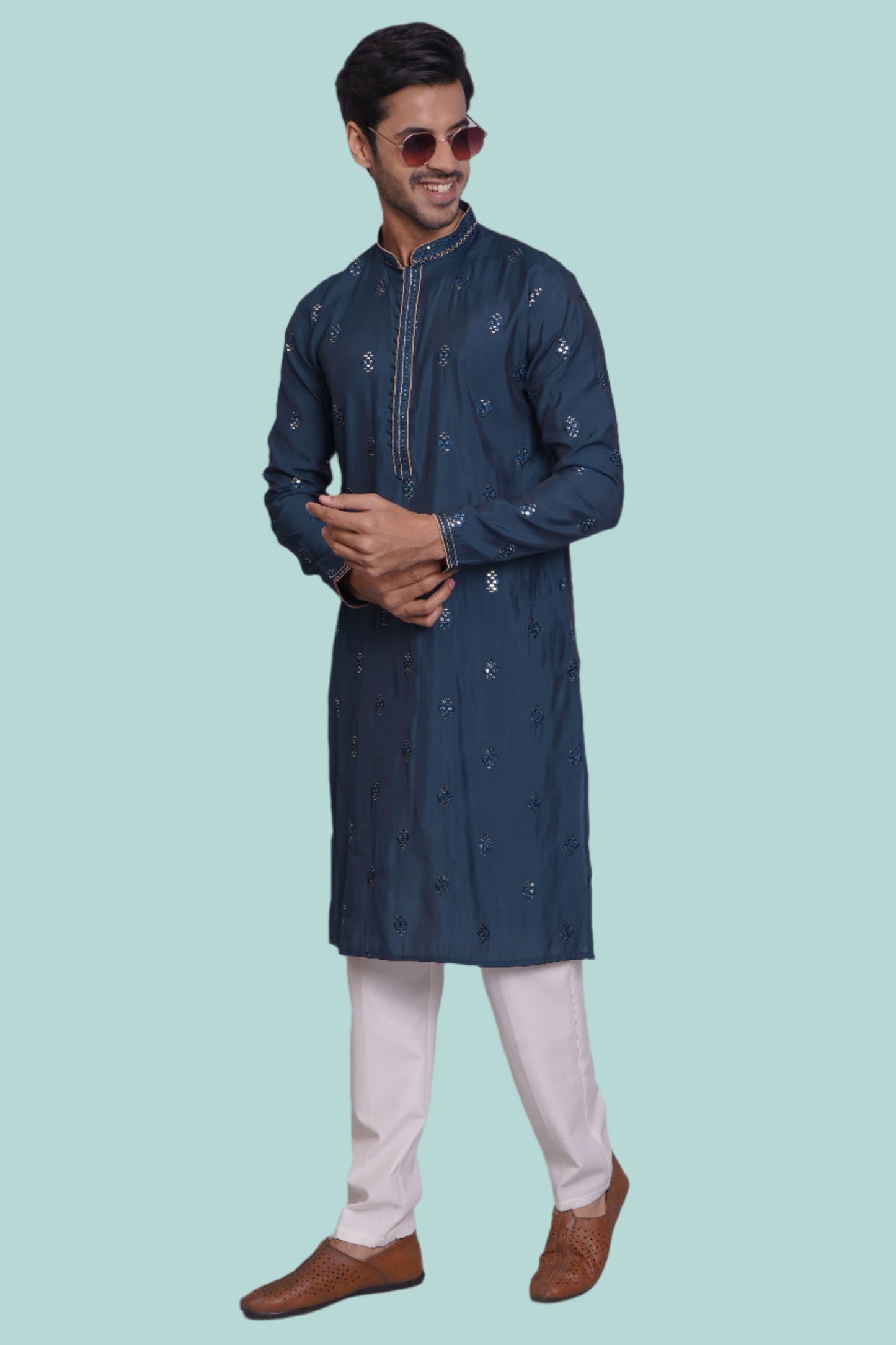Men's navy blue silk blend kurta with embroidered neckline, sequin work and matching white pajama - traditional Indian ethnic wear for festivals and social occasions.