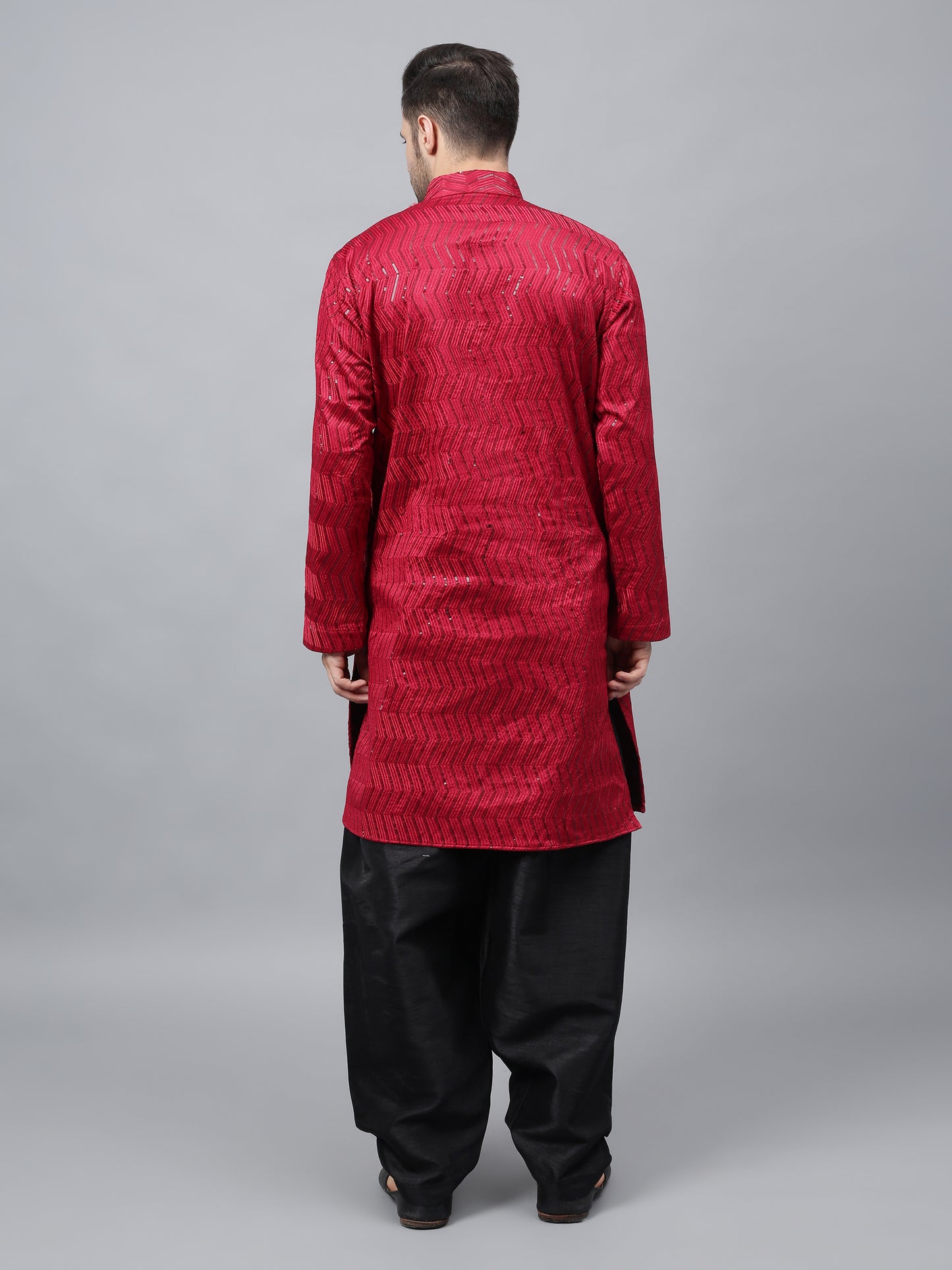 Men's bright red silk kurta with chevron pattern and black salwar - traditional Indian ethnic wear for festivals and social gatherings