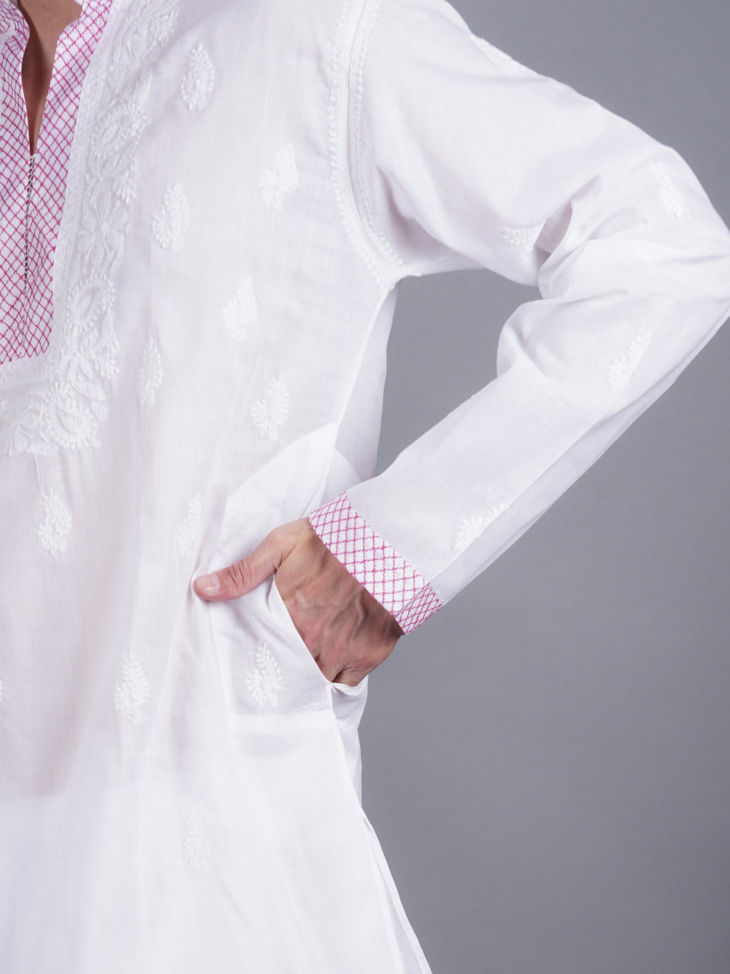 Men White chikankari Kurta made of pure white Linen, full length, button closure, pink thread work on placket, full sleeves, mandarin collar, side pockets, traditional wear for family occasions, casual wear