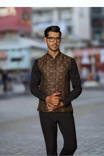 Men's black Nehru or Modi jacket vest with intricate golden botanical print, worn over dress shirt - traditional Indian formal wear