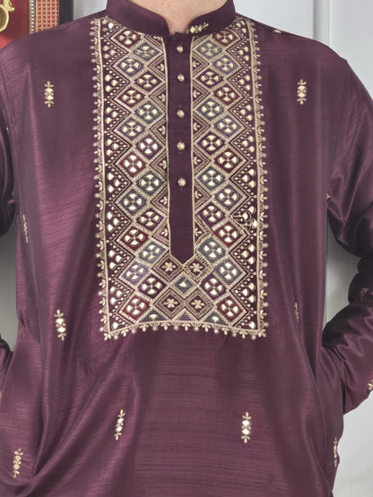 Men's maroon kurta with embroidered neckline paired with white churidar, mandarin collar, side pockets, full sleeves - premium Indian formal wear for weddings and special occasions