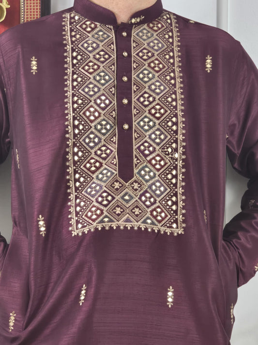 Men's maroon kurta with embroidered neckline paired with white churidar, mandarin collar, side pockets, full sleeves - premium Indian formal wear for weddings and special occasions