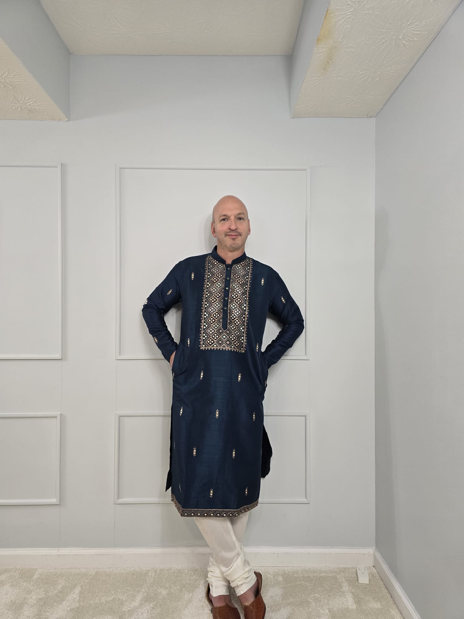 Men's blue kurta with embroidered neckline paired with white churidar, mandarin collar, side pockets, full sleeves - premium Indian formal wear for weddings and special occasions