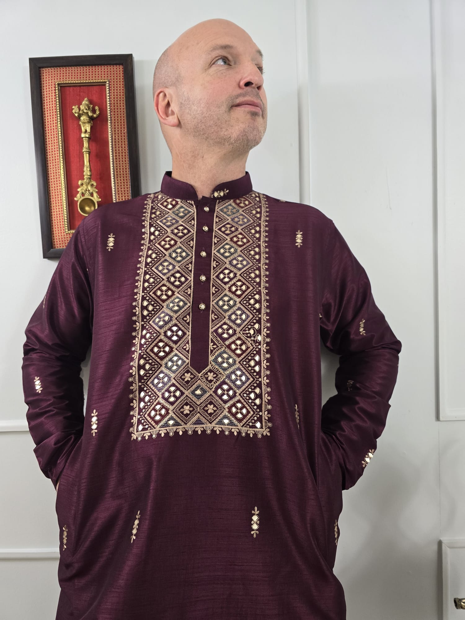 Men's maroon kurta with embroidered neckline paired with white churidar, mandarin collar, side pockets, full sleeves - premium Indian formal wear for weddings and special occasions