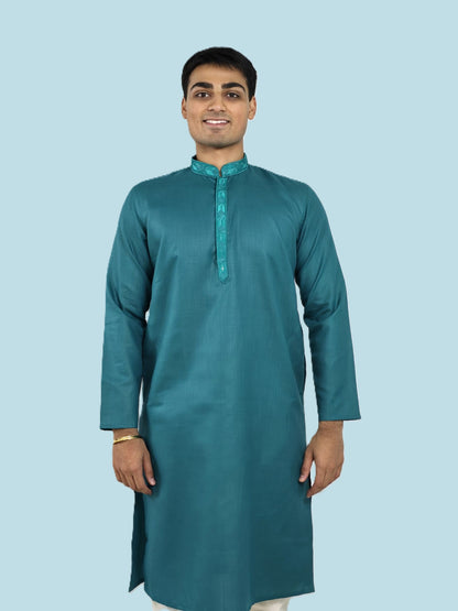 Men's blue kurta with embroidered neckline paired with white churidar, mandarin collar, side pockets, full sleeves - premium Indian formal wear for weddings and special occasions