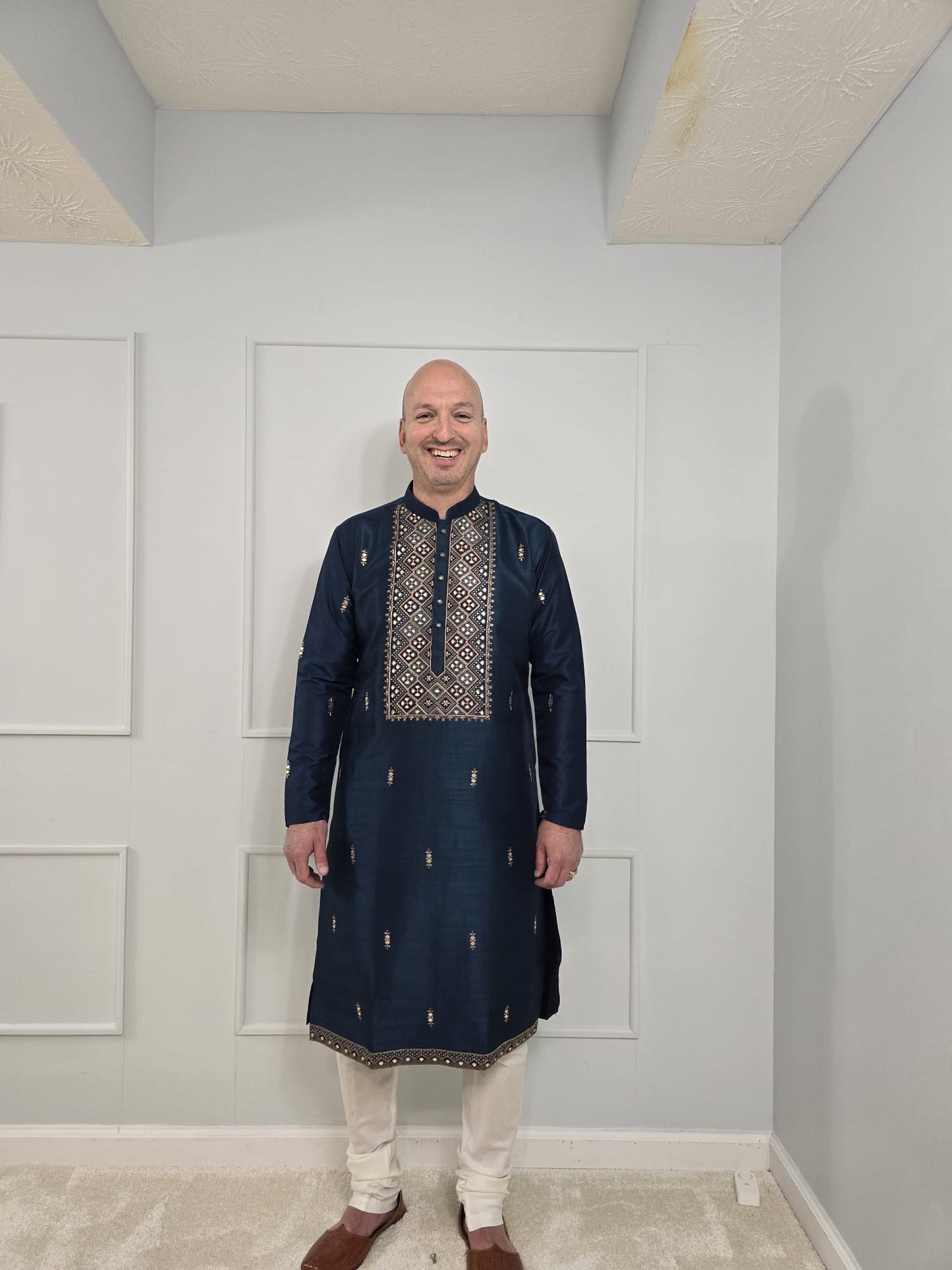 Men's blue kurta with embroidered neckline paired with white churidar, mandarin collar, side pockets, full sleeves - premium Indian formal wear for weddings and special occasions