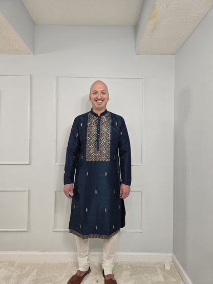 Men's blue kurta with embroidered neckline paired with white churidar, mandarin collar, side pockets, full sleeves - premium Indian formal wear for weddings and special occasions