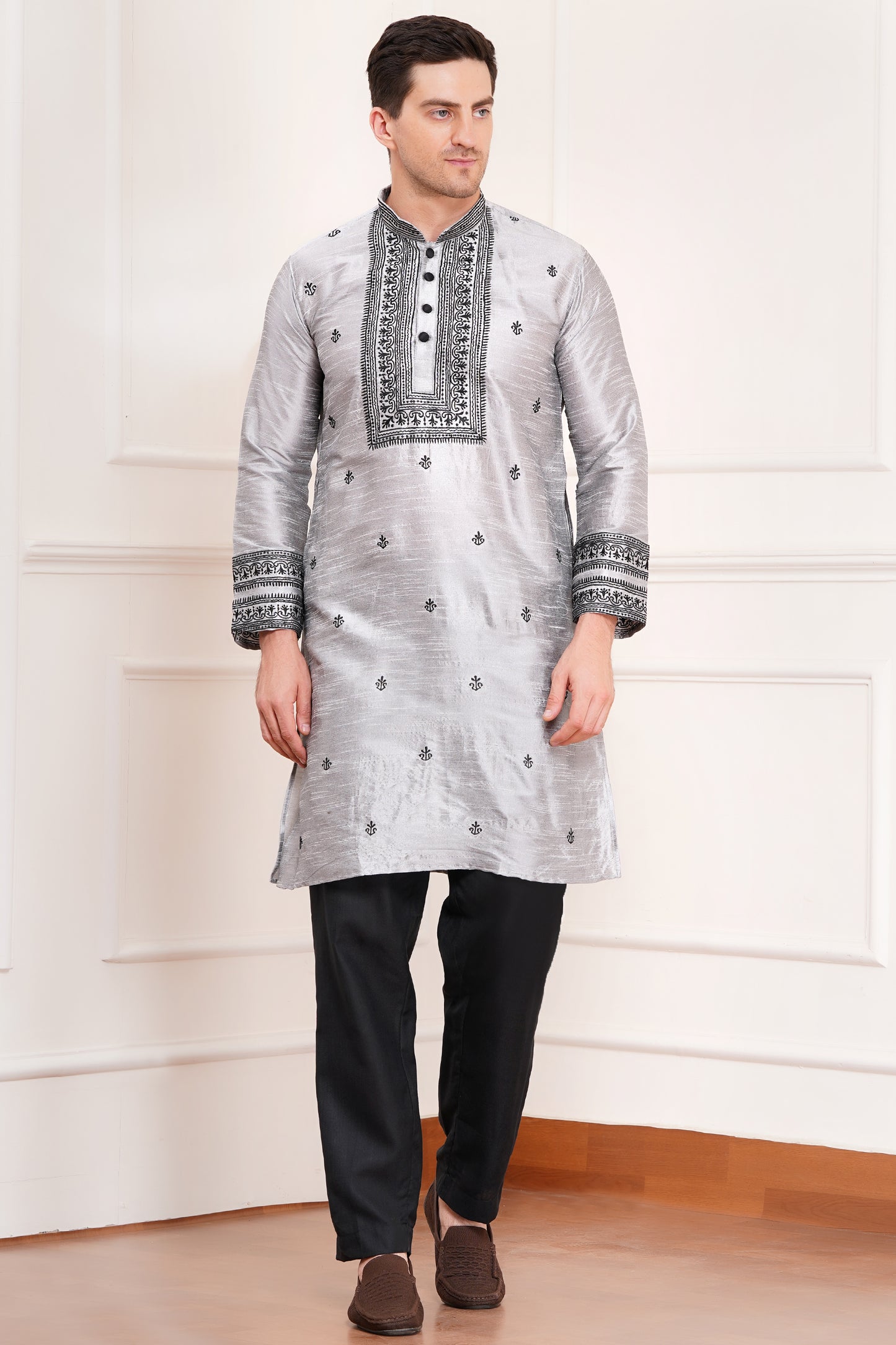 Men's gray silk kurta with black embroidered mandarin collar and cuffs, side pockets, full sleeves with black pants - traditional Indian formal wear for weddings and festivals