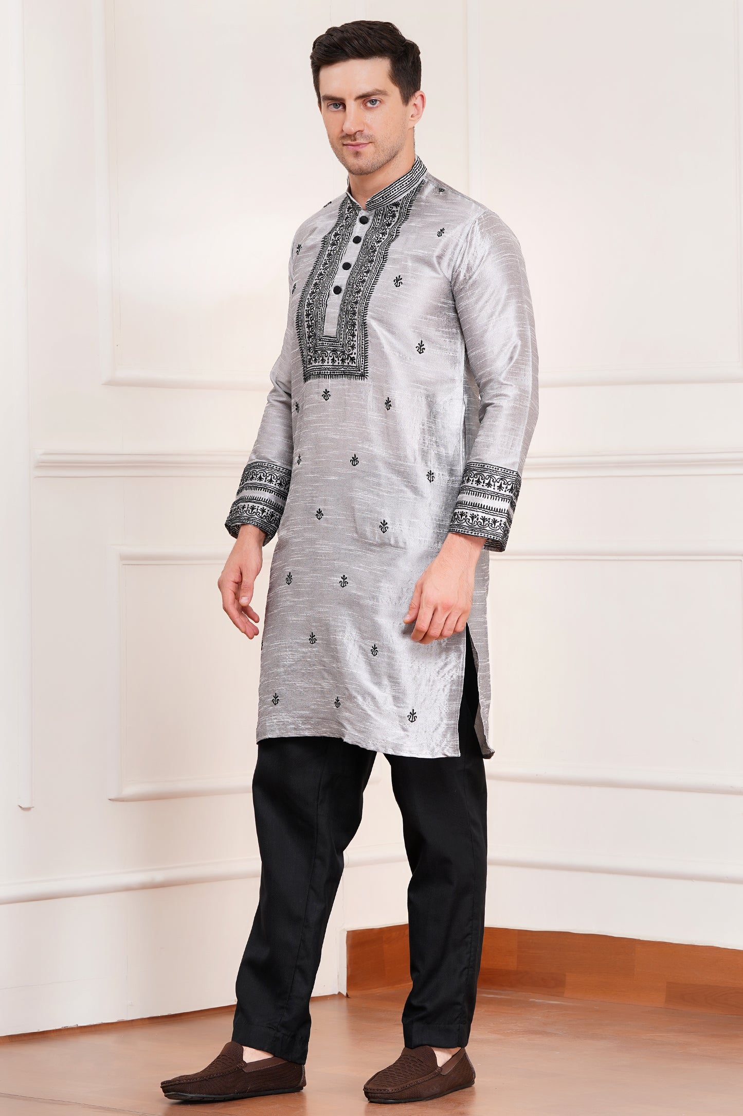 Men's gray silk kurta with black embroidered mandarin collar and cuffs, side pockets, full sleeves with black pants - traditional Indian formal wear for weddings and festivals