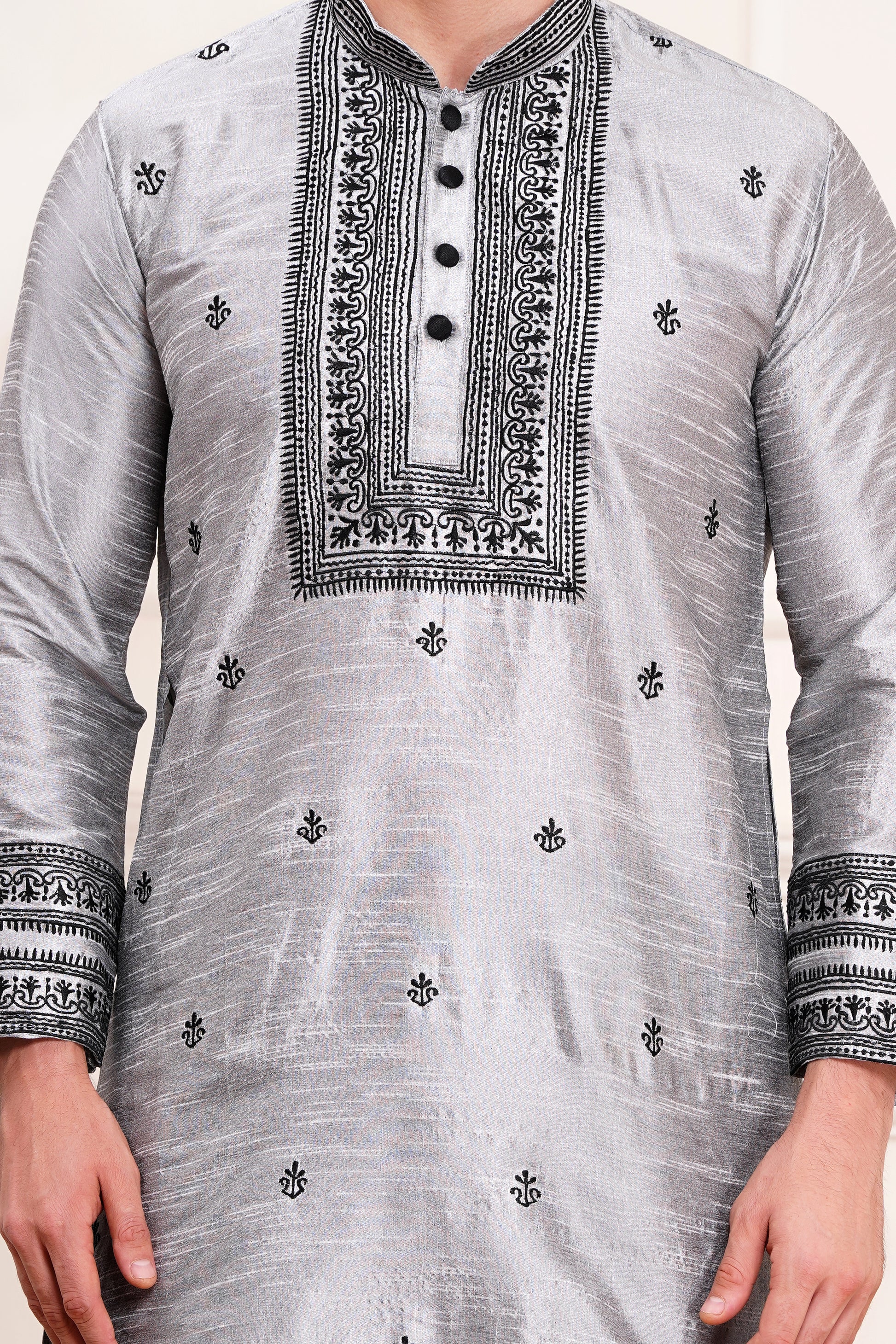 Men's gray silk kurta with black embroidered mandarin collar and cuffs, side pockets, full sleeves with black pants - traditional Indian formal wear for weddings and festivals