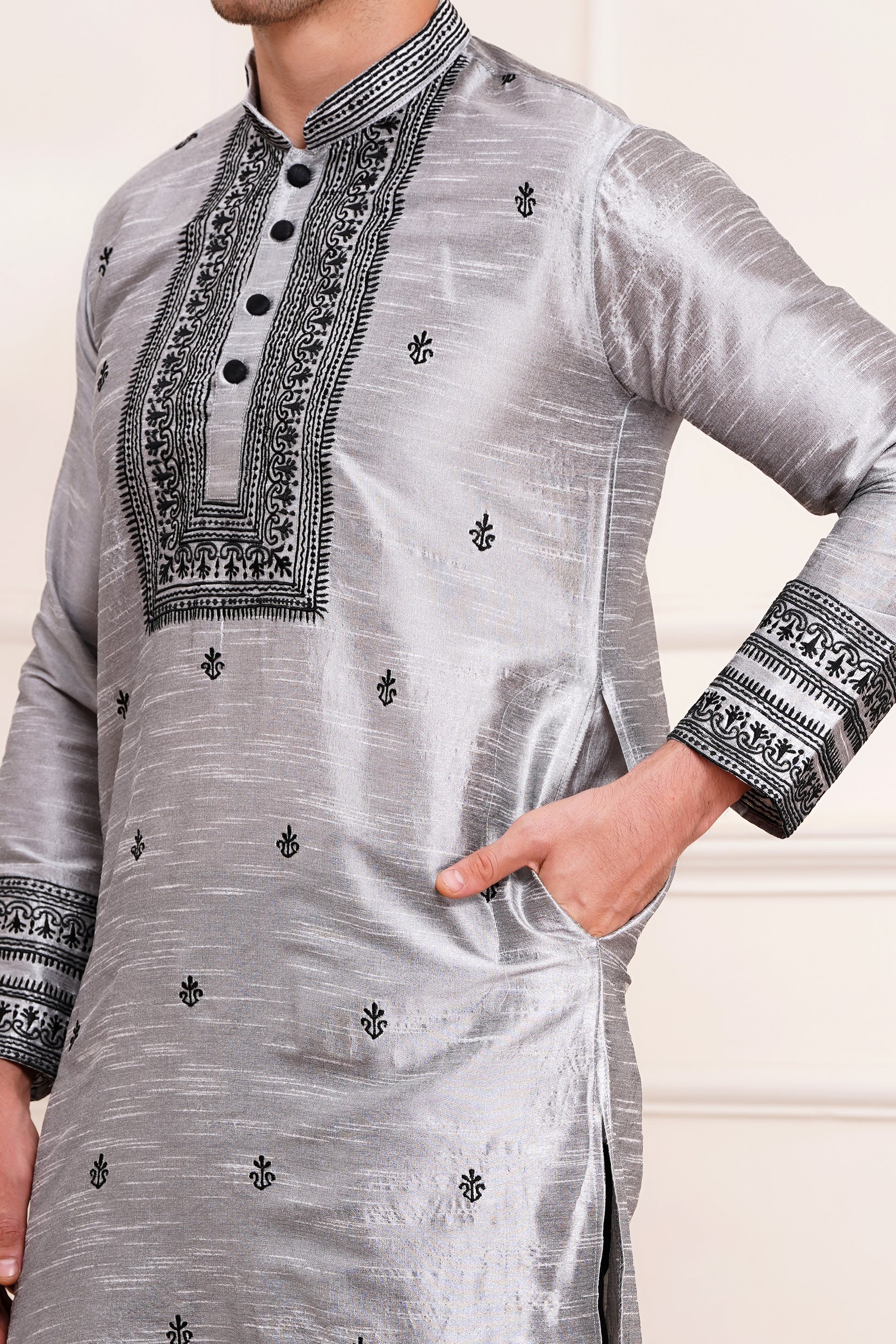 Men's gray silk kurta with black embroidered mandarin collar and cuffs, side pockets, full sleeves with black pants - traditional Indian formal wear for weddings and festivals
