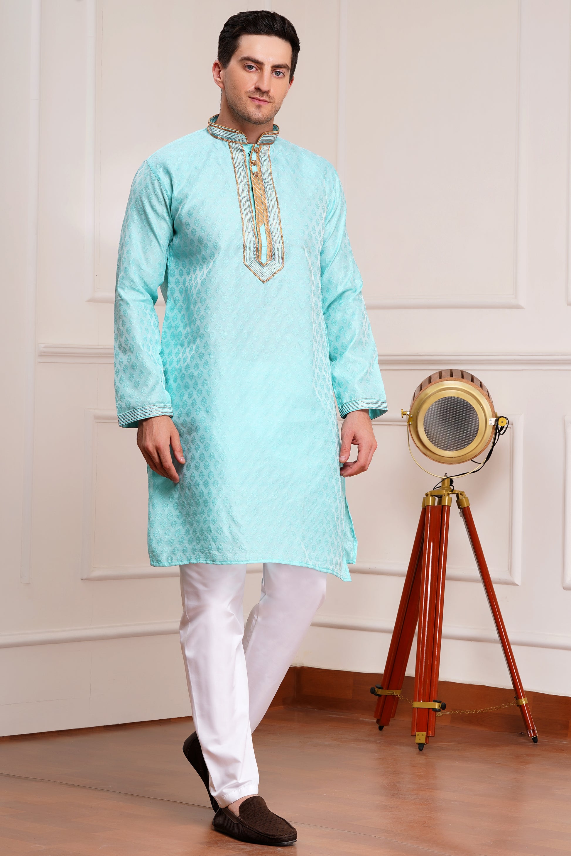 Men's light blue brocade kurta with gold embroidered neckline paired with white churidar, mandarin collar, side pockets, full sleeves - premium Indian formal wear for weddings and special occasions