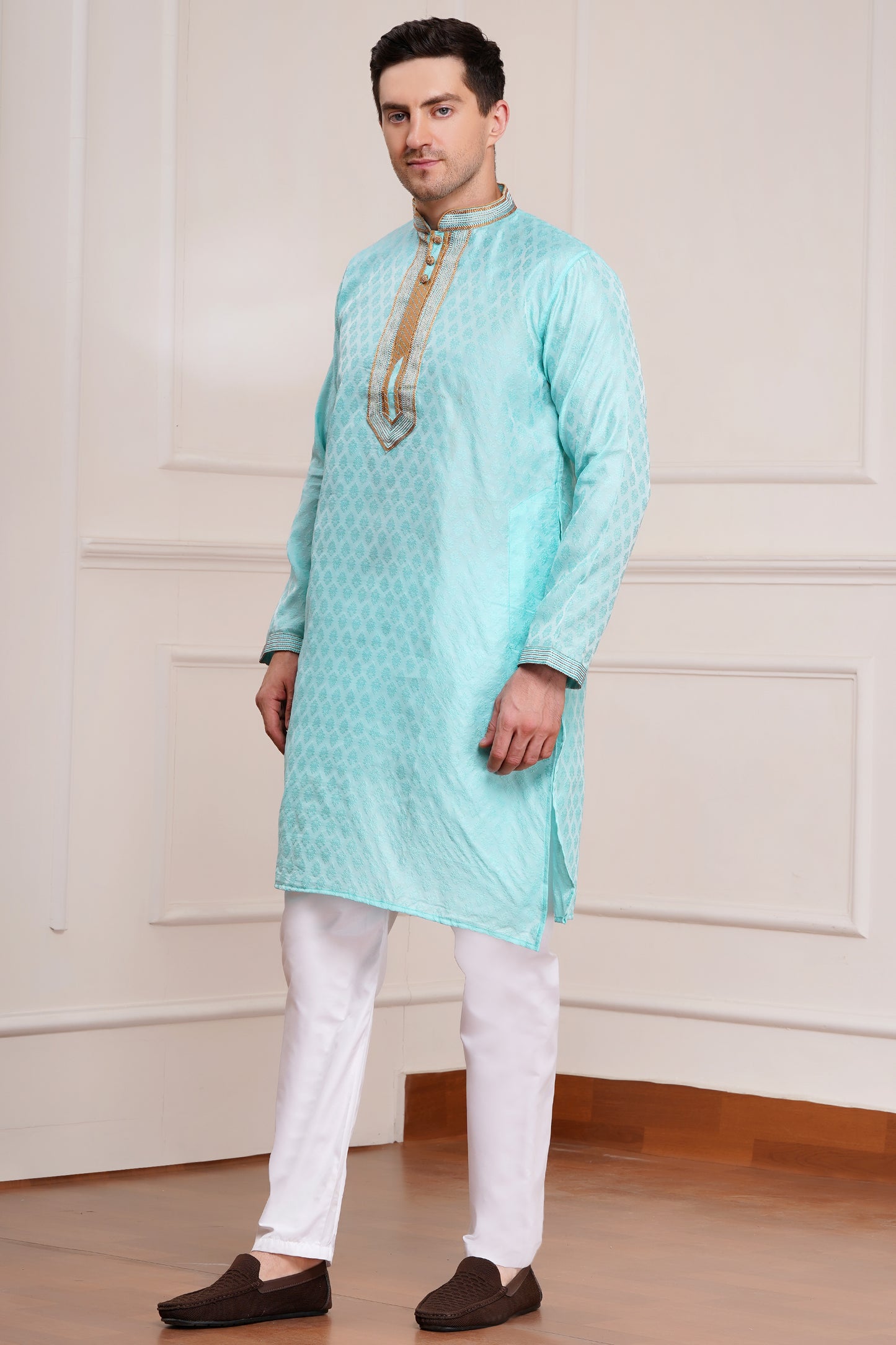Men's light blue brocade kurta with gold embroidered neckline paired with white churidar, mandarin collar, side pockets, full sleeves - premium Indian formal wear for weddings and special occasions