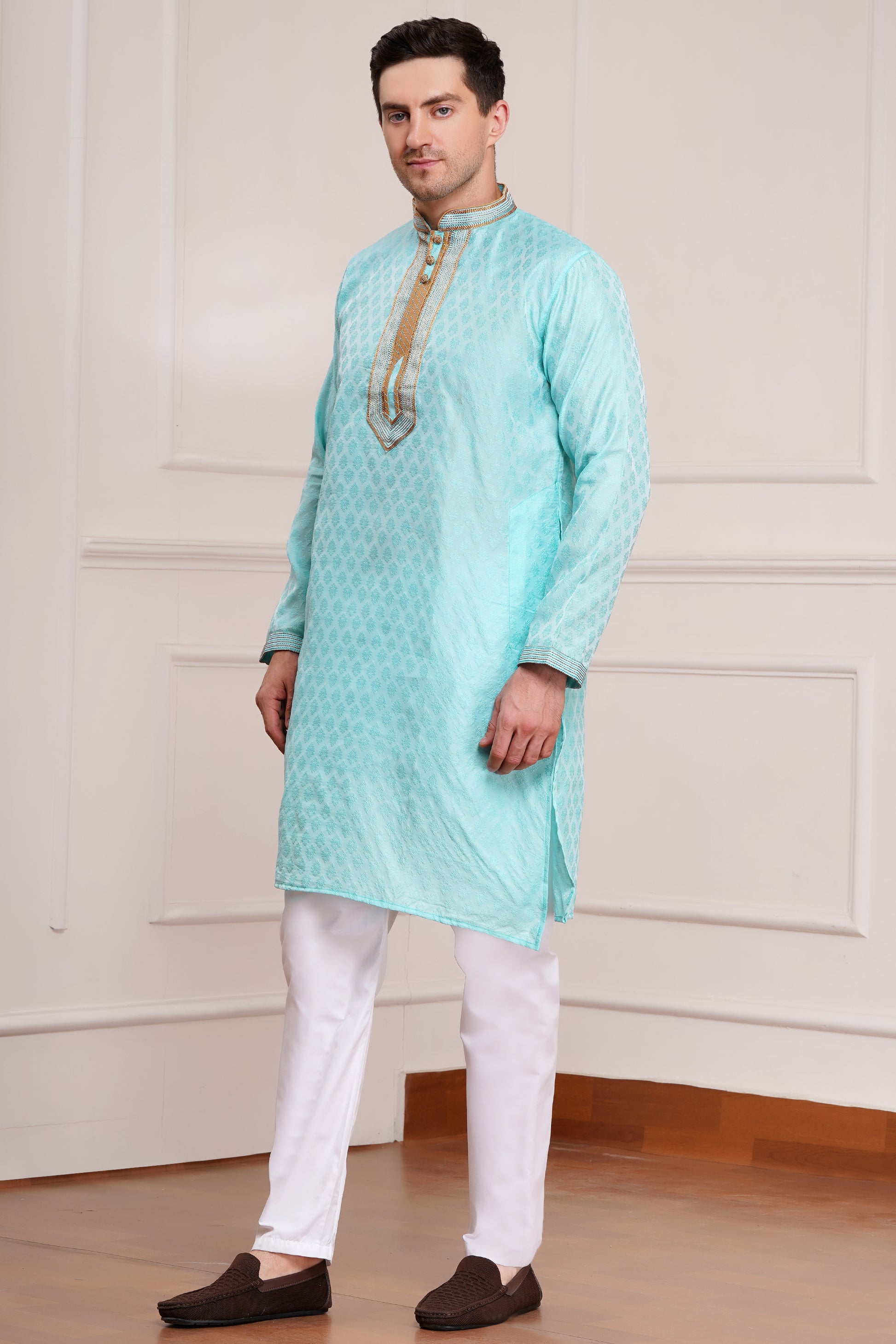 Men's light blue brocade kurta with gold embroidered neckline paired with white churidar, mandarin collar, side pockets, full sleeves - premium Indian formal wear for weddings and special occasions