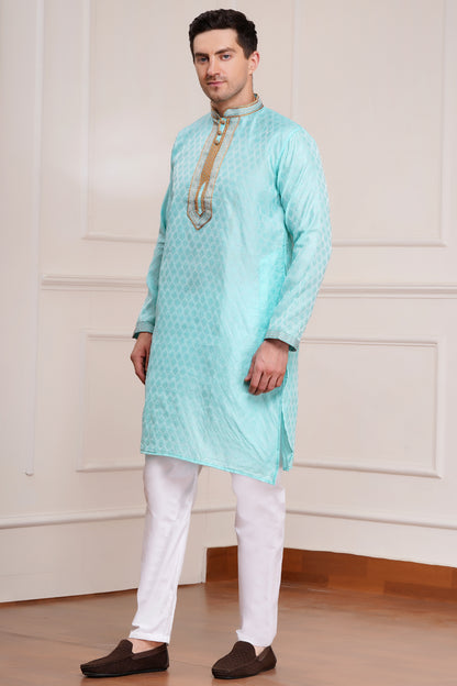 Men's light blue brocade kurta with gold embroidered neckline paired with white churidar, mandarin collar, side pockets, full sleeves - premium Indian formal wear for weddings and special occasions