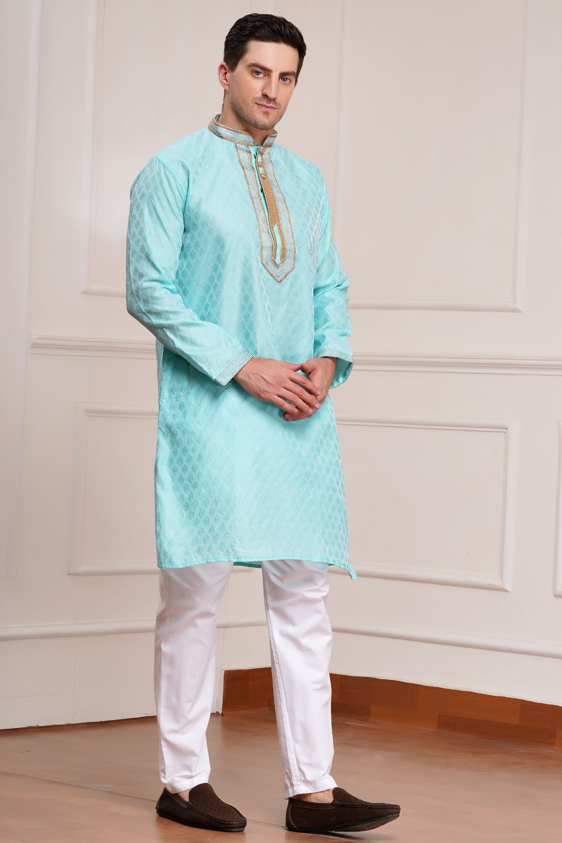 Men's light blue brocade kurta with gold embroidered neckline paired with white churidar, mandarin collar, side pockets, full sleeves - premium Indian formal wear for weddings and special occasions