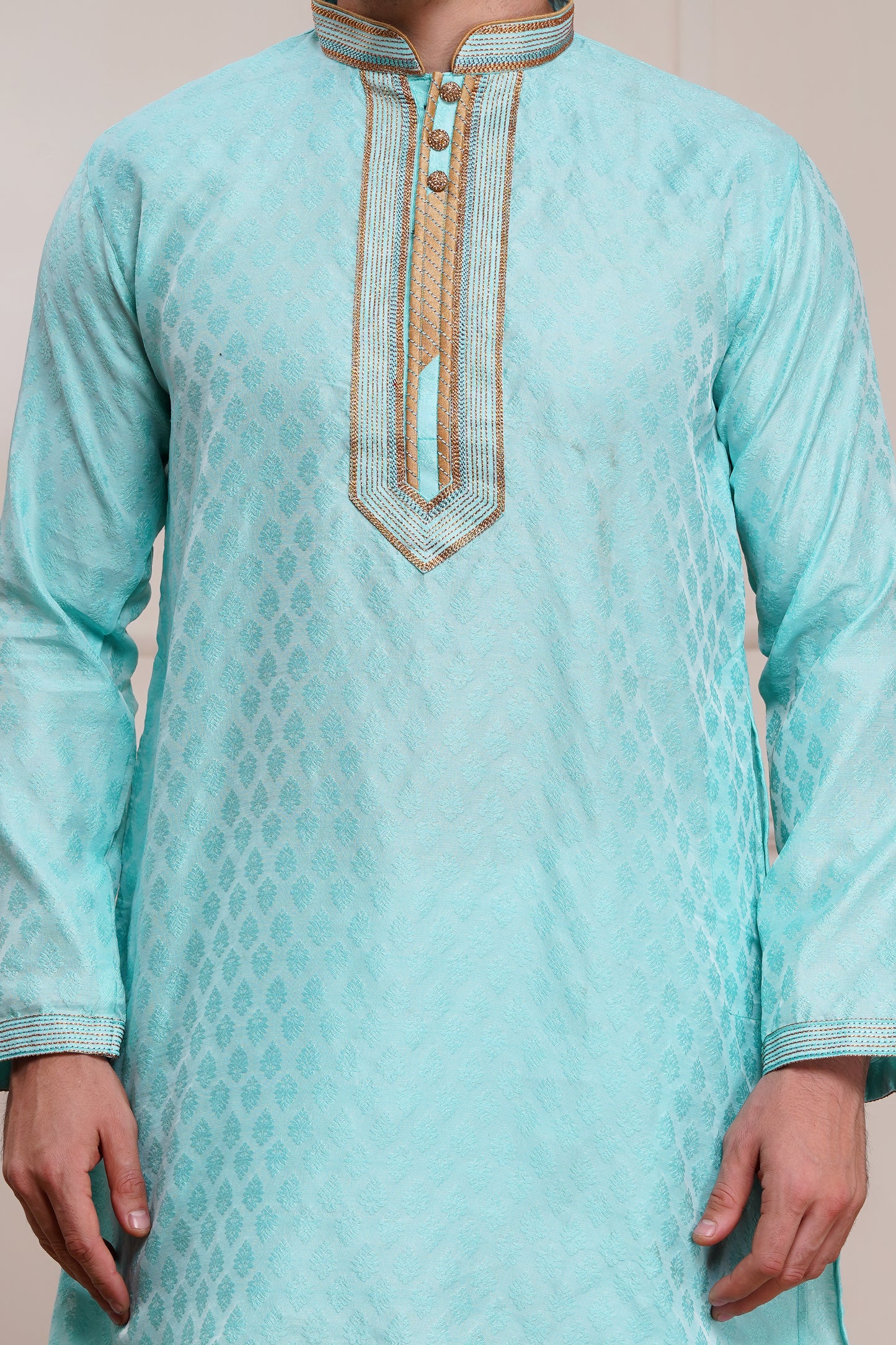Men's light blue brocade kurta with gold embroidered neckline paired with white churidar, mandarin collar, side pockets, full sleeves - premium Indian formal wear for weddings and special occasions