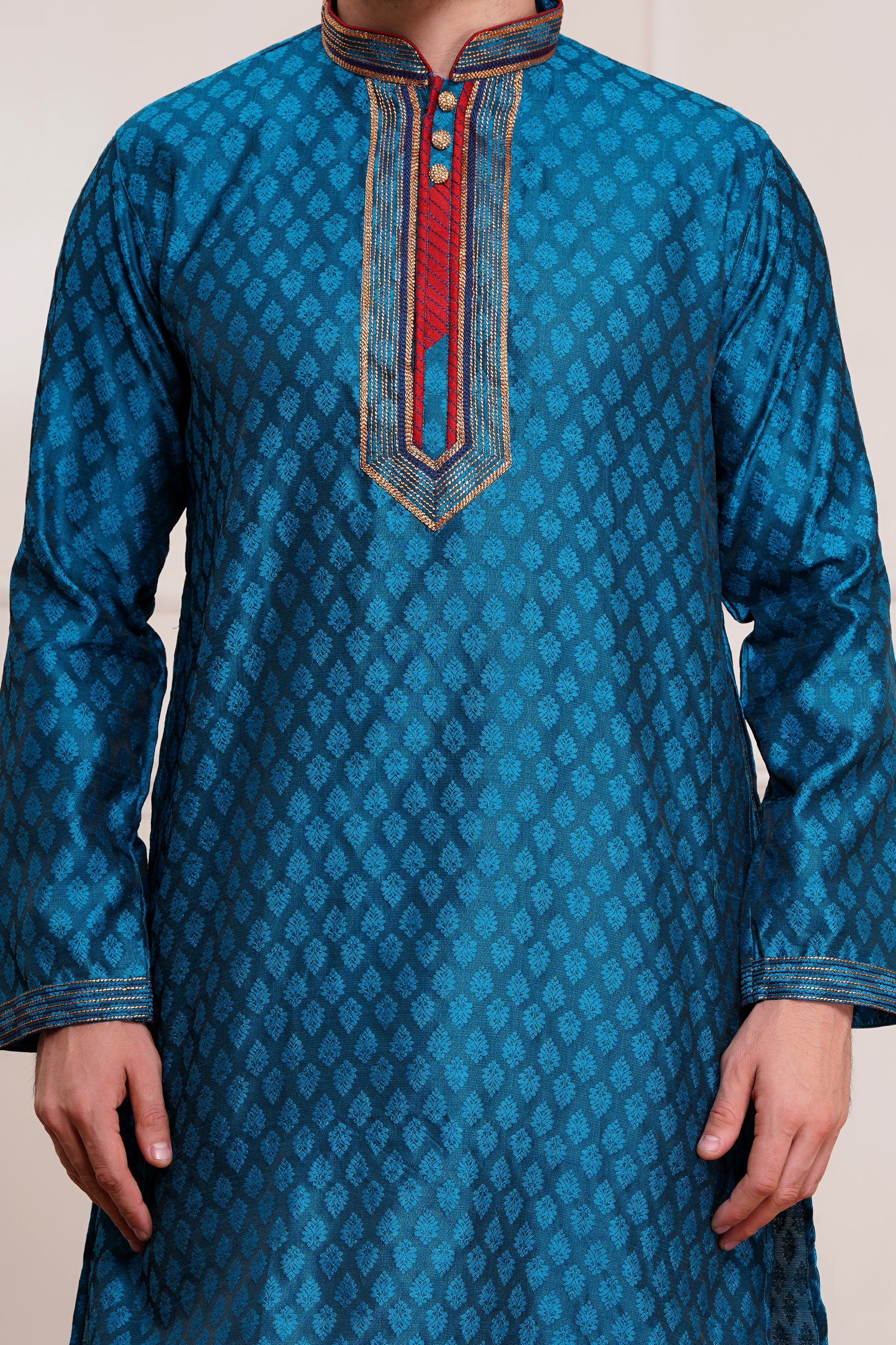 Men's teal blue brocade kurta with red and gold embroidered neckline paired with white churidar, mandarin collar, side pockets, full sleeves - premium Indian formal wear for weddings and special occasions