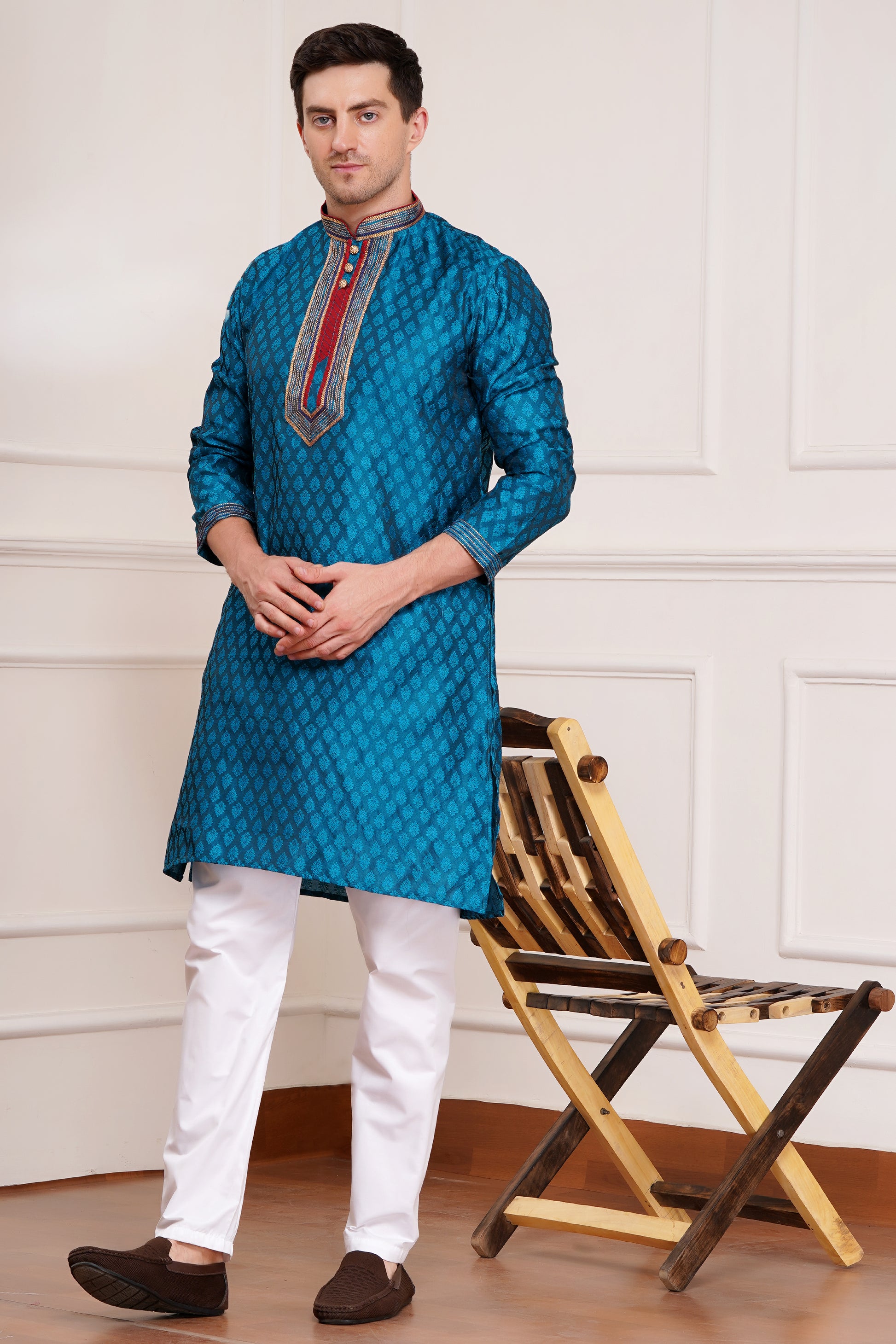 Men's teal blue brocade kurta with red and gold embroidered neckline paired with white churidar, mandarin collar, side pockets, full sleeves - premium Indian formal wear for weddings and special occasions