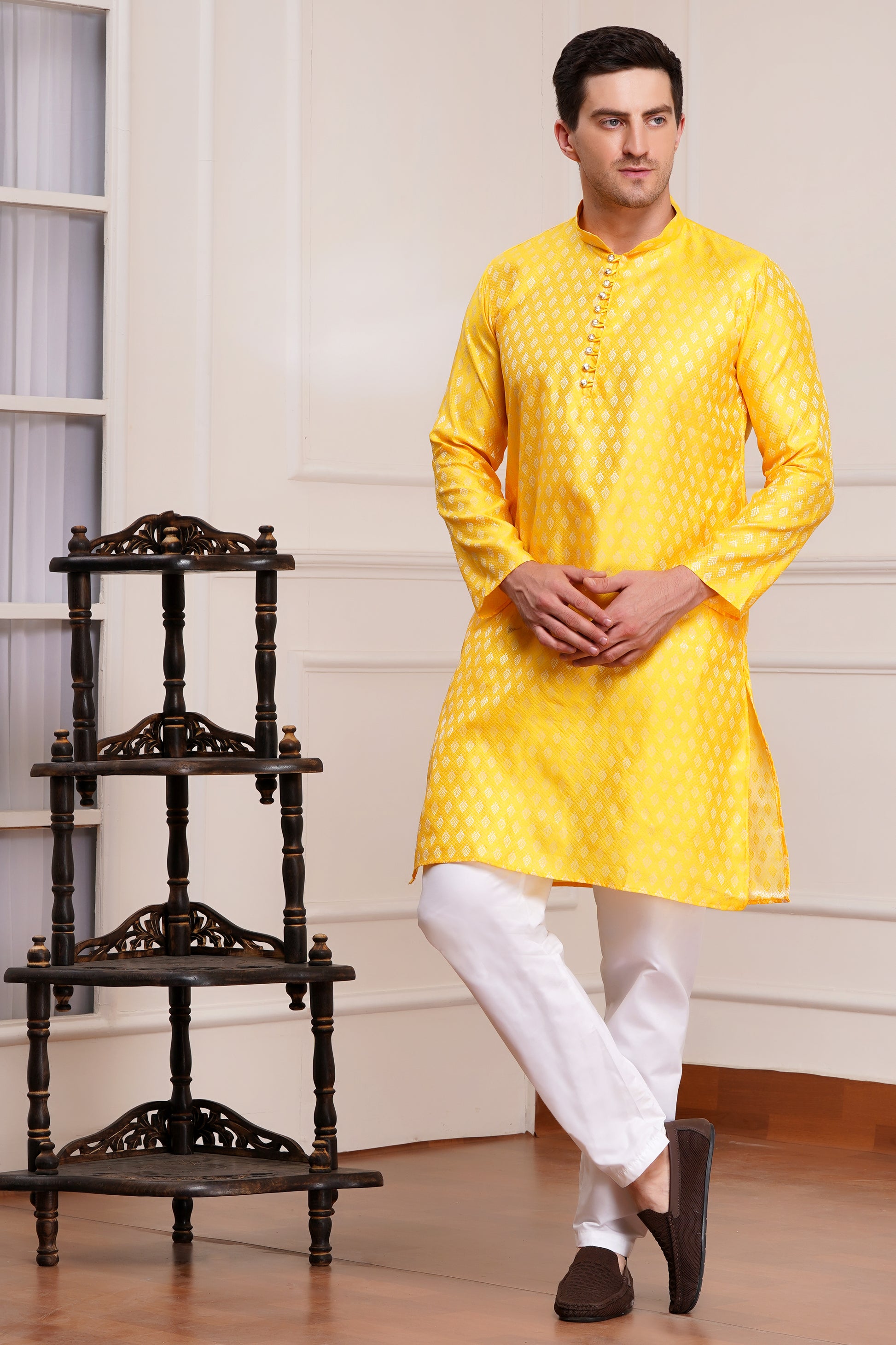 Men's bright yellow silk kurta with gold brocade diamond pattern and white churidar pants, decorative buttons with loop closure, mandarin collar, full sleeves, side pockets - traditional Indian festive wear