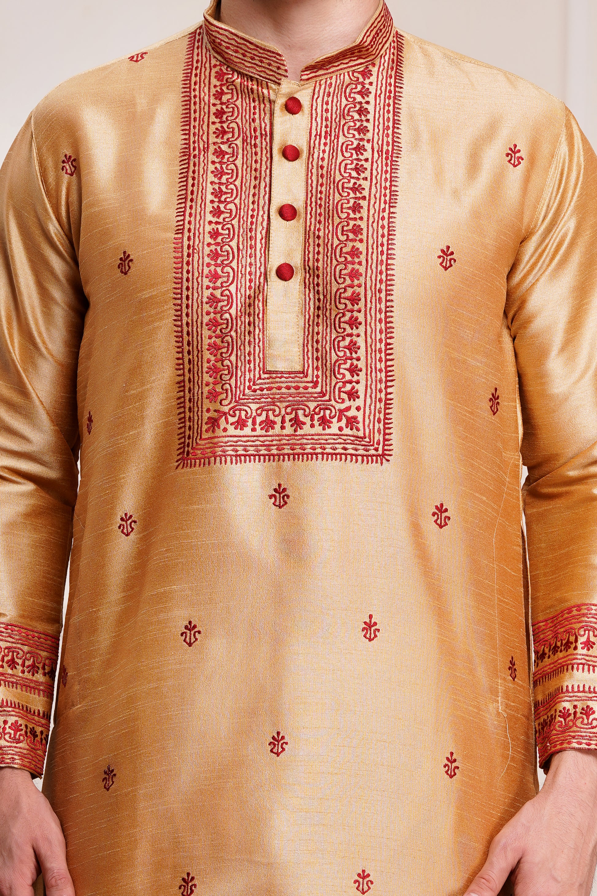 Men's beige silk kurta with maroon embroidered mandarin collar and cuffs, side pockets, full sleeves with off-white or cream pants - traditional Indian formal wear for weddings and festivals