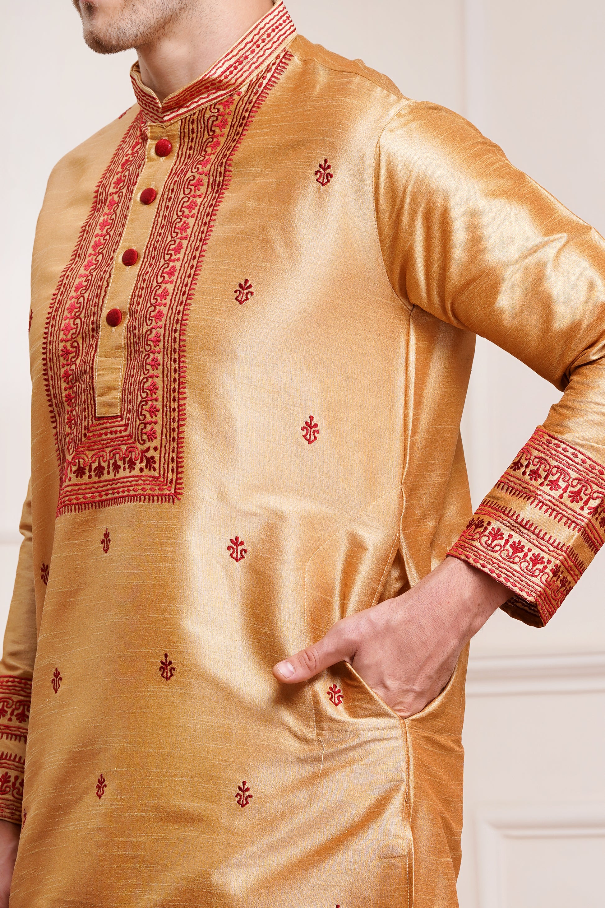 Men's beige silk kurta with maroon embroidered mandarin collar and cuffs, side pockets, full sleeves with off-white or cream pants - traditional Indian formal wear for weddings and festivals