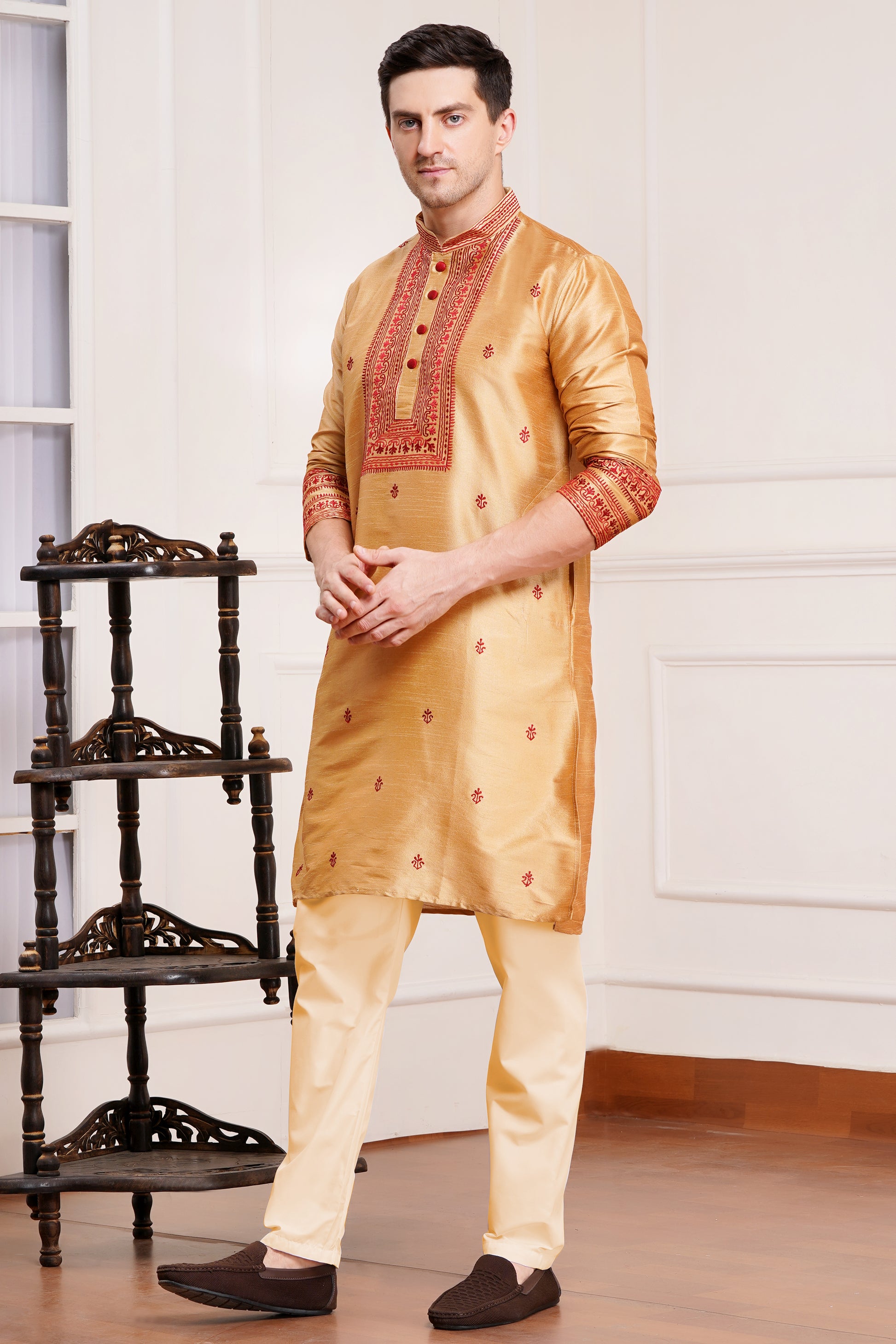 Men's beige silk kurta with maroon embroidered mandarin collar and cuffs, side pockets, full sleeves with off-white or cream pants - traditional Indian formal wear for weddings and festivals