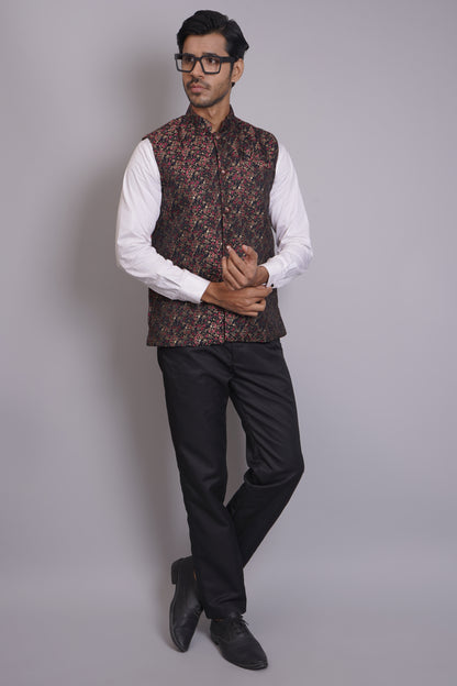 Men's dark floral patterned Nehru or Modi jacket vest with intricate red and gold botanical print, worn over dress shirt - traditional Indian formal wear