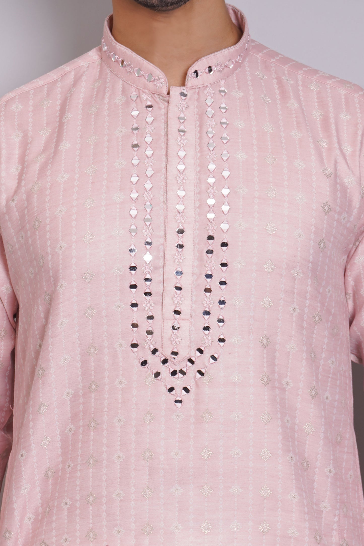 Men's pink kurta with mirror embroidered neckline paired with white churidar, mandarin collar, side pockets, full sleeves - premium Indian formal wear for weddings and special occasions