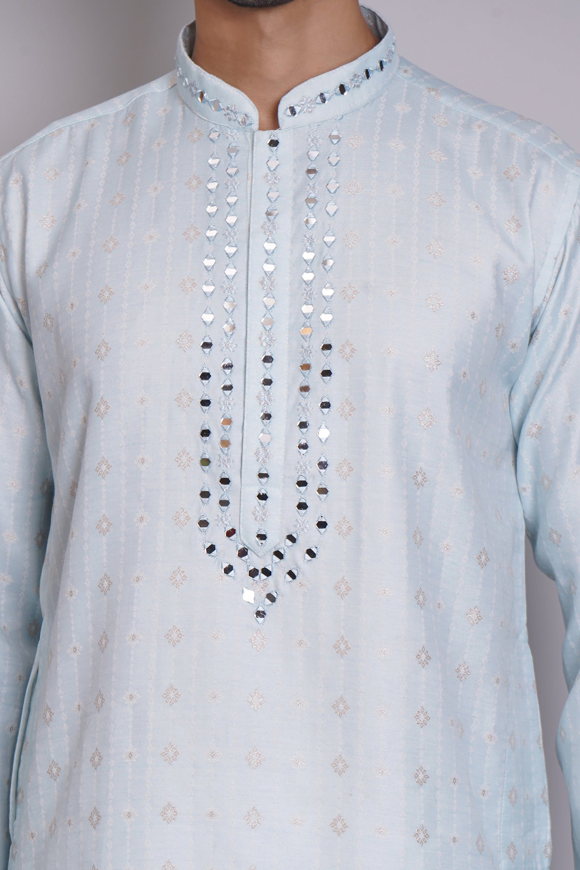 Men's light blue kurta with mirror embroidered neckline paired with white churidar, mandarin collar, side pockets, full sleeves - premium Indian formal wear for weddings and special occasions