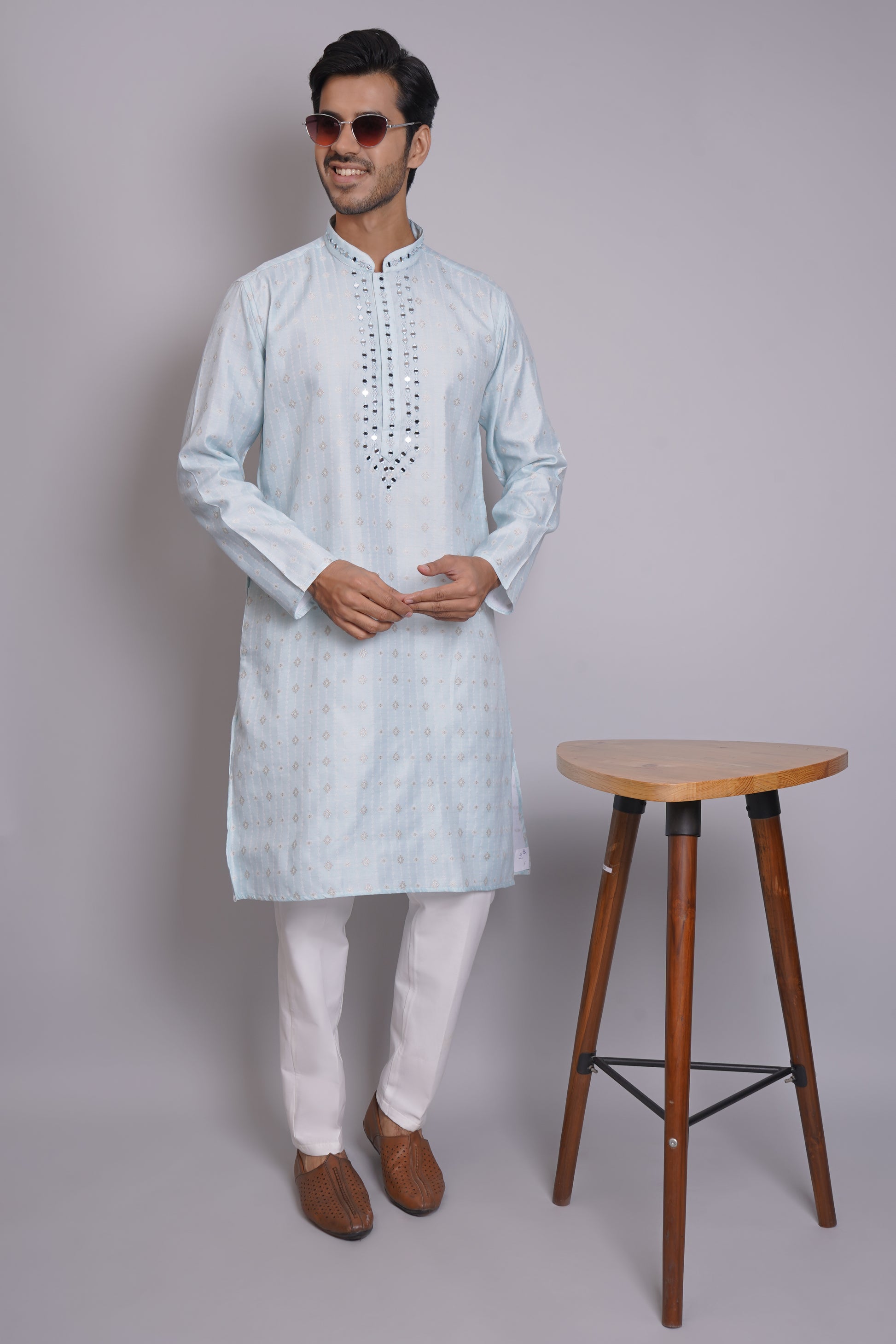 Men's light blue kurta with mirror embroidered neckline paired with white churidar, mandarin collar, side pockets, full sleeves - premium Indian formal wear for weddings and special occasions