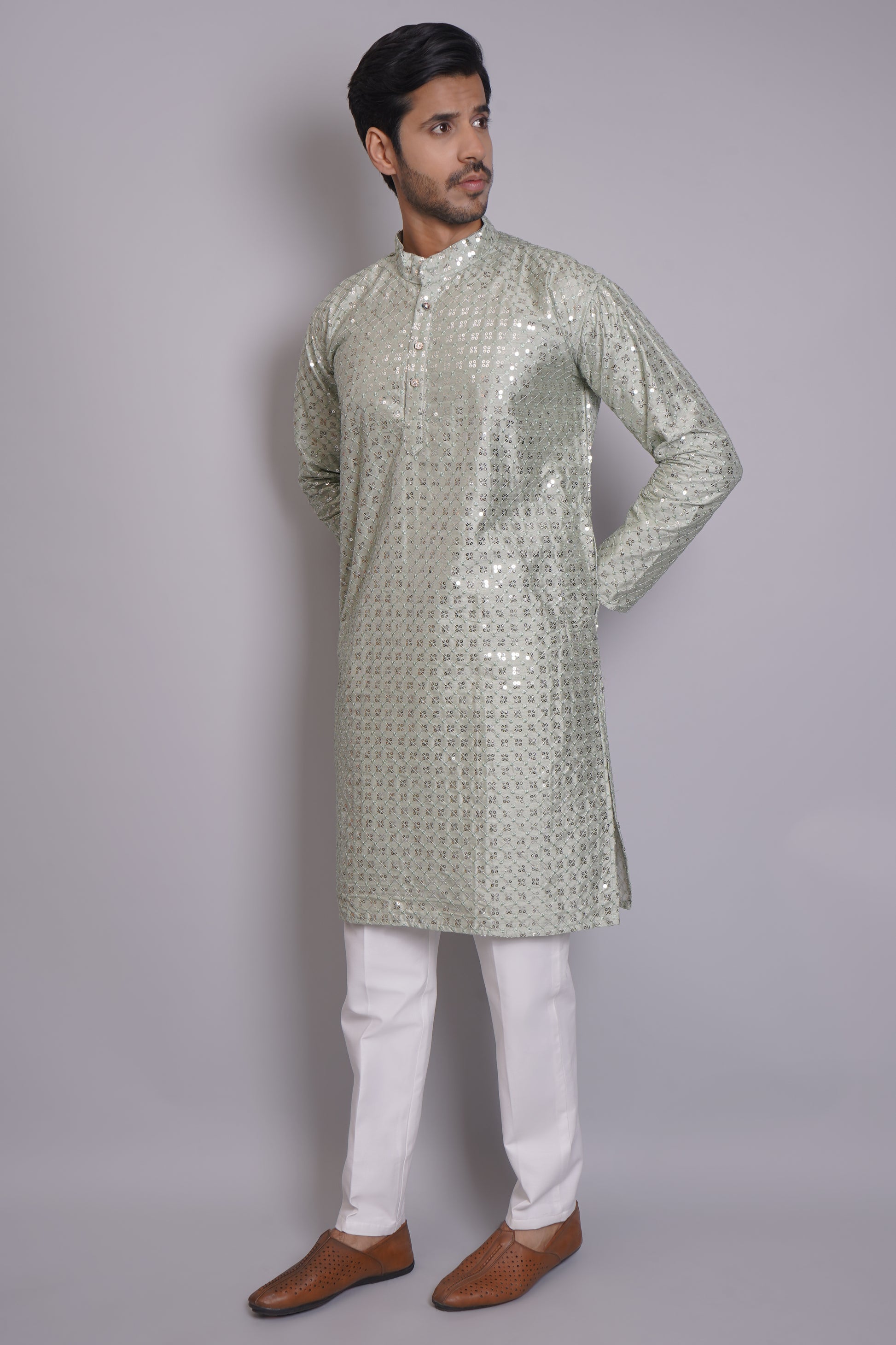 Men's soft green sequin kurta with mandarin collar and white pajama, featuring all-over sequin embellishment for Indian ethnic wear and festive occasions