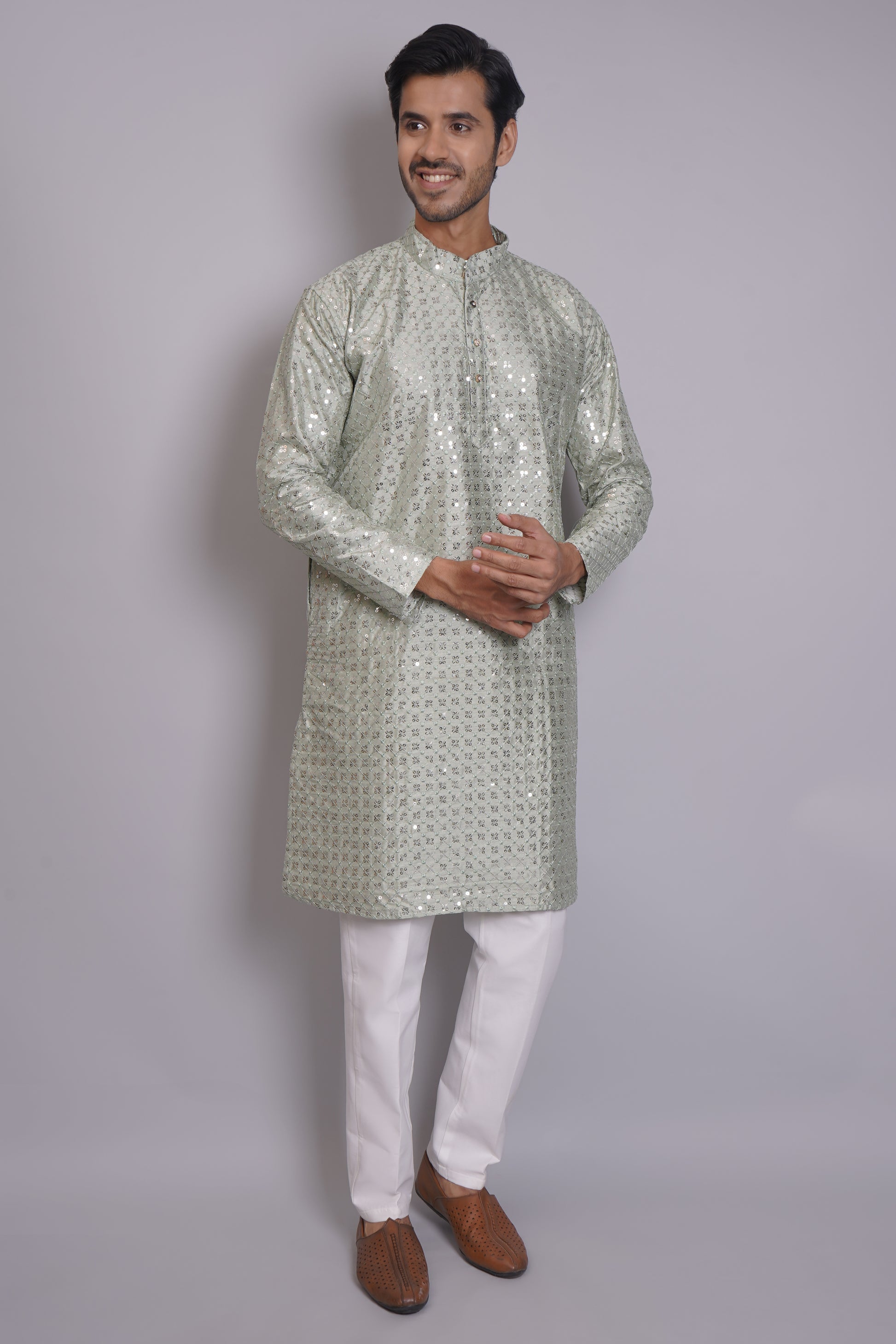 Men's soft green sequin kurta with mandarin collar and white pajama, featuring all-over sequin embellishment for Indian ethnic wear and festive occasions
