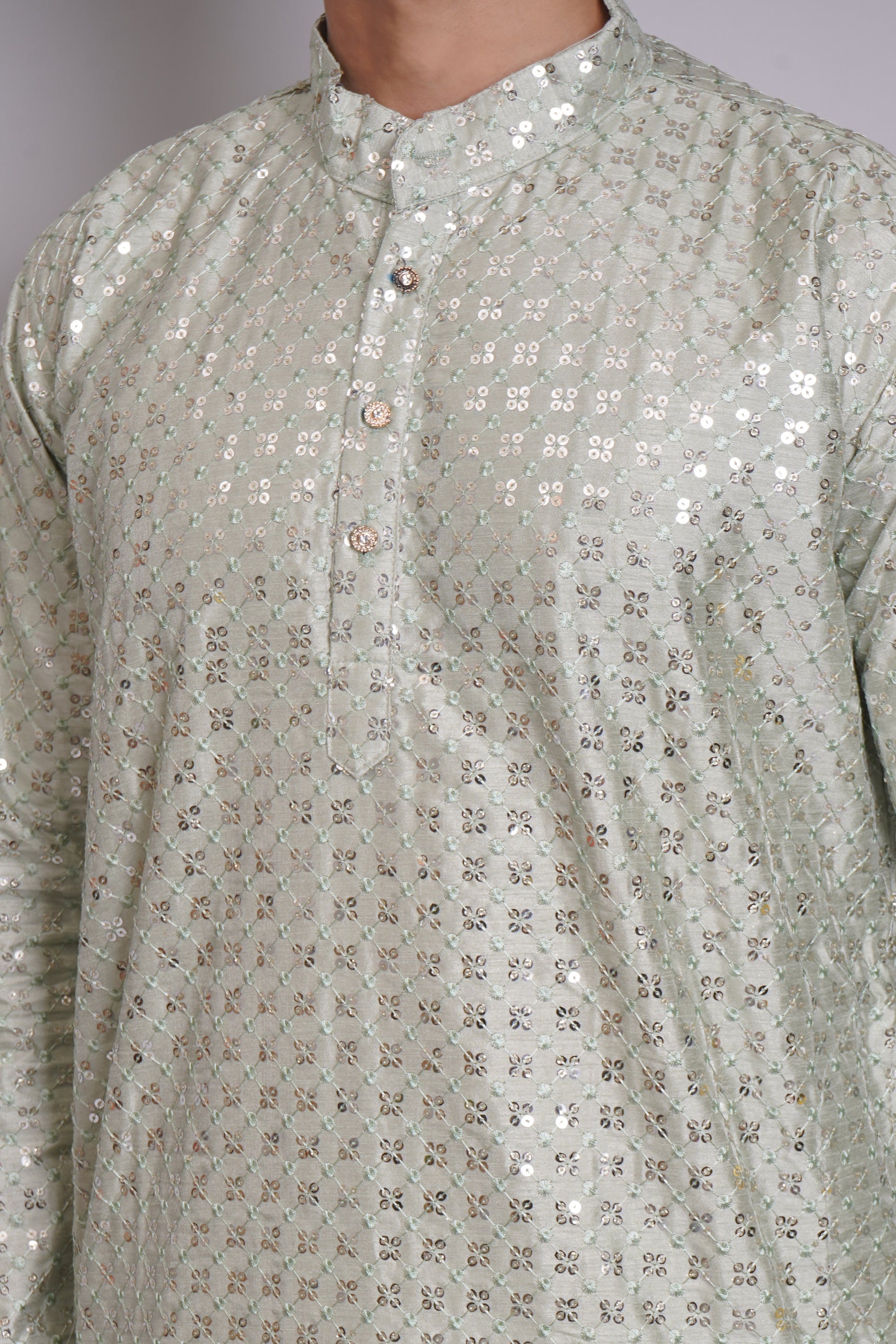 Men's soft green sequin kurta with mandarin collar and white pajama, featuring all-over sequin embellishment for Indian ethnic wear and festive occasions