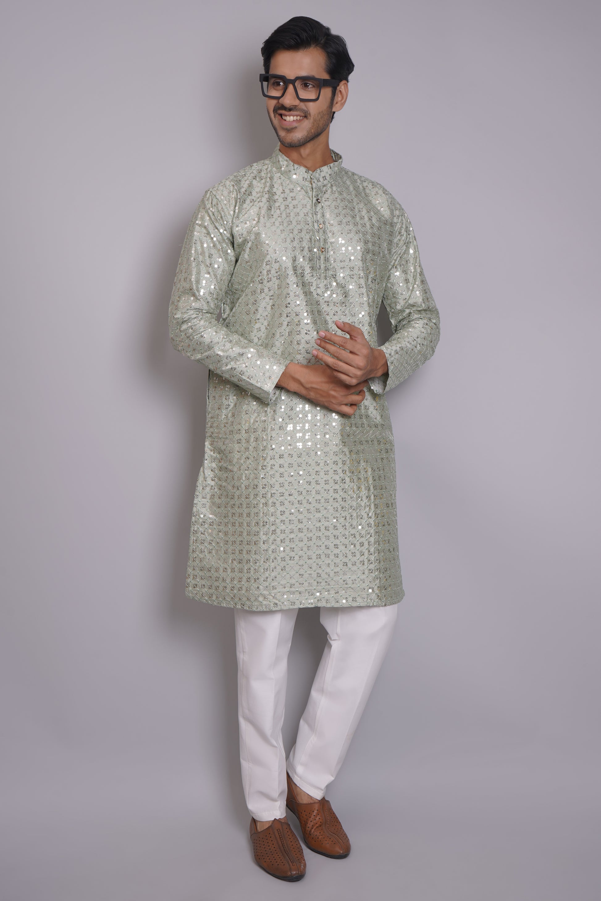 Men's soft green sequin kurta with mandarin collar and white pajama, featuring all-over sequin embellishment for Indian ethnic wear and festive occasions