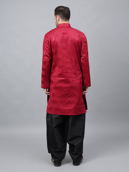 Men's bright red silk kurta with chevron pattern and black salwar - traditional Indian ethnic wear for festivals and social gatherings