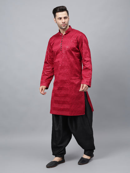 Men's bright red silk kurta with chevron pattern and black salwar - traditional Indian ethnic wear for festivals and social gatherings