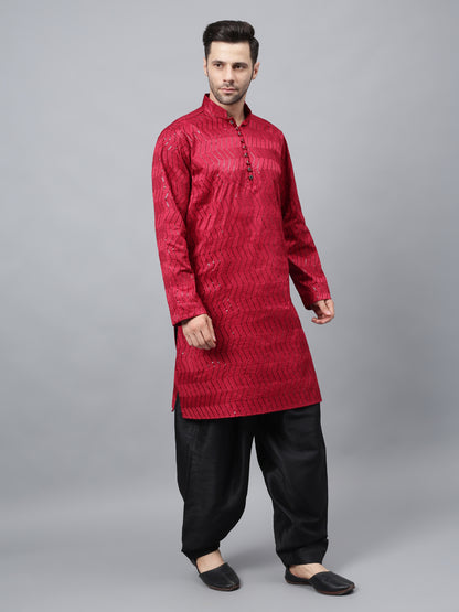 Men's bright red silk kurta with chevron pattern and black salwar - traditional Indian ethnic wear for festivals and social gatherings