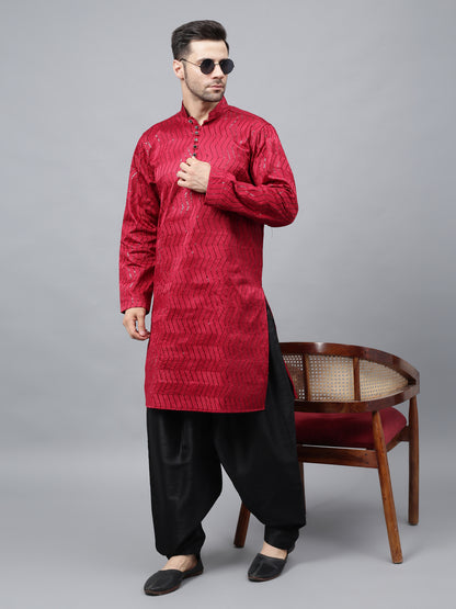 Men's bright red silk kurta with chevron pattern and black salwar - traditional Indian ethnic wear for festivals and social gatherings