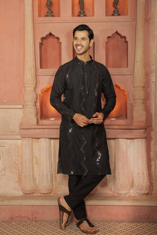 Men black embroidered kurta with intricate thread and mirror work paired with black pajama, mandarin collar, button closure, covered placket, traditional Indian ethnic wear set for festive and wedding occasions, formal wear for special occasions