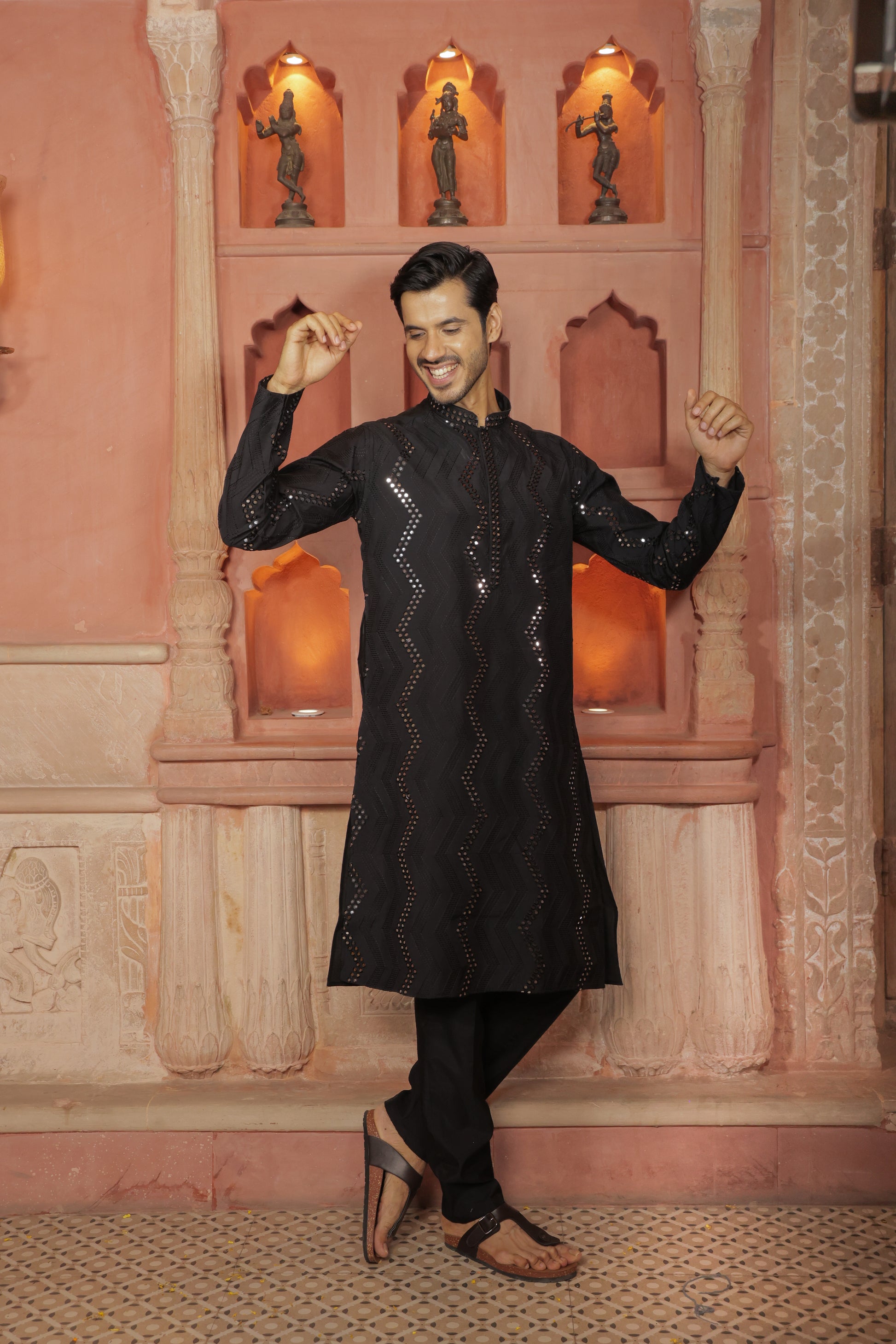 Men black embroidered kurta with intricate thread and mirror work paired with black pajama, mandarin collar, button closure, covered placket, traditional Indian ethnic wear set for festive and wedding occasions, formal wear for special occasions