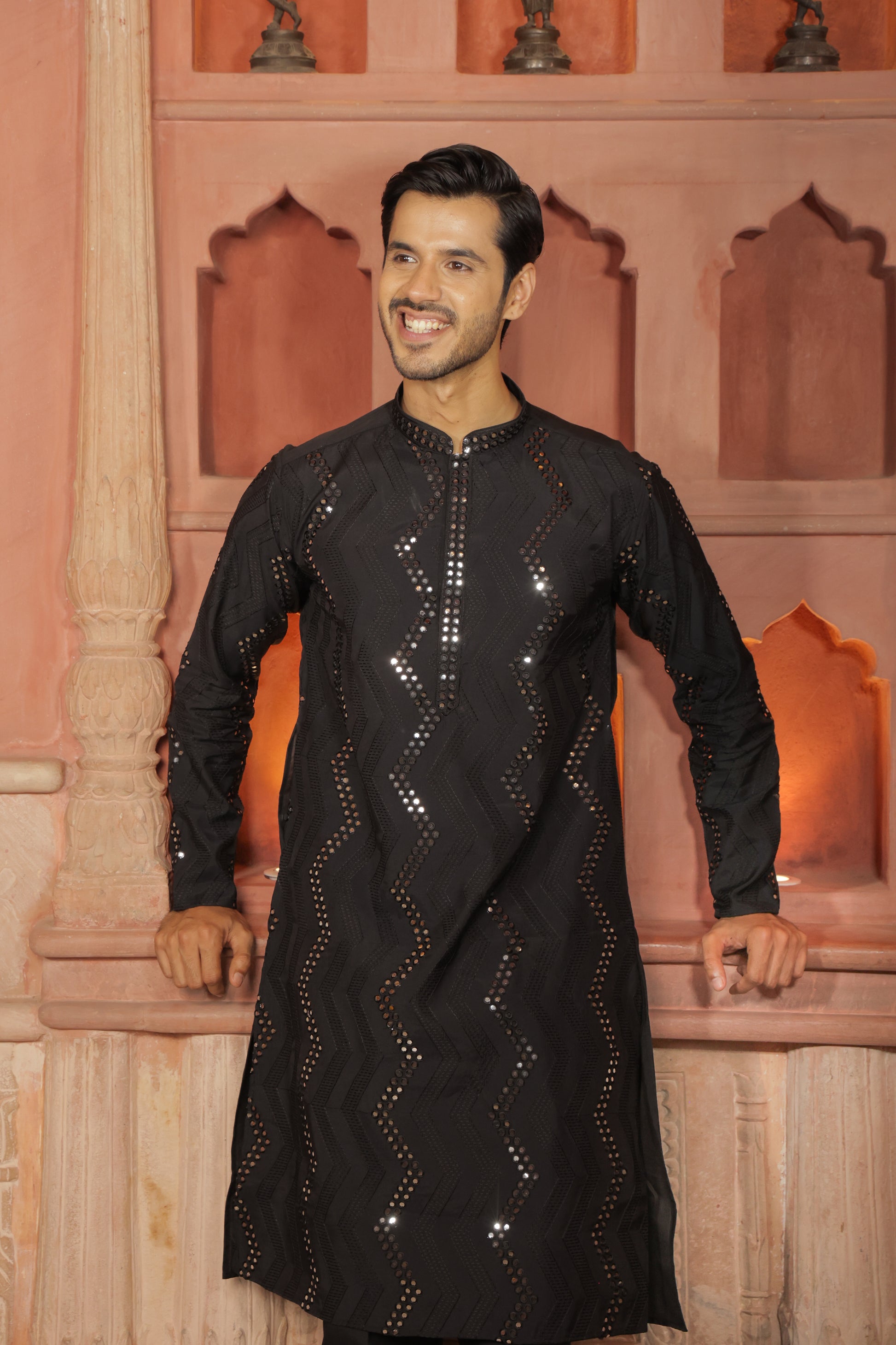 Men black embroidered kurta with intricate thread and mirror work paired with black pajama, mandarin collar, button closure, covered placket, traditional Indian ethnic wear set for festive and wedding occasions, formal wear for special occasions