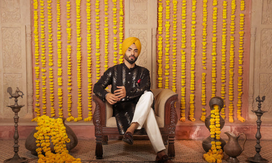 Men's black kurta silver embroidered in front paired with white churidar, mandarin collar, side pockets, full sleeves - premium Indian formal wear for weddings and special occasions