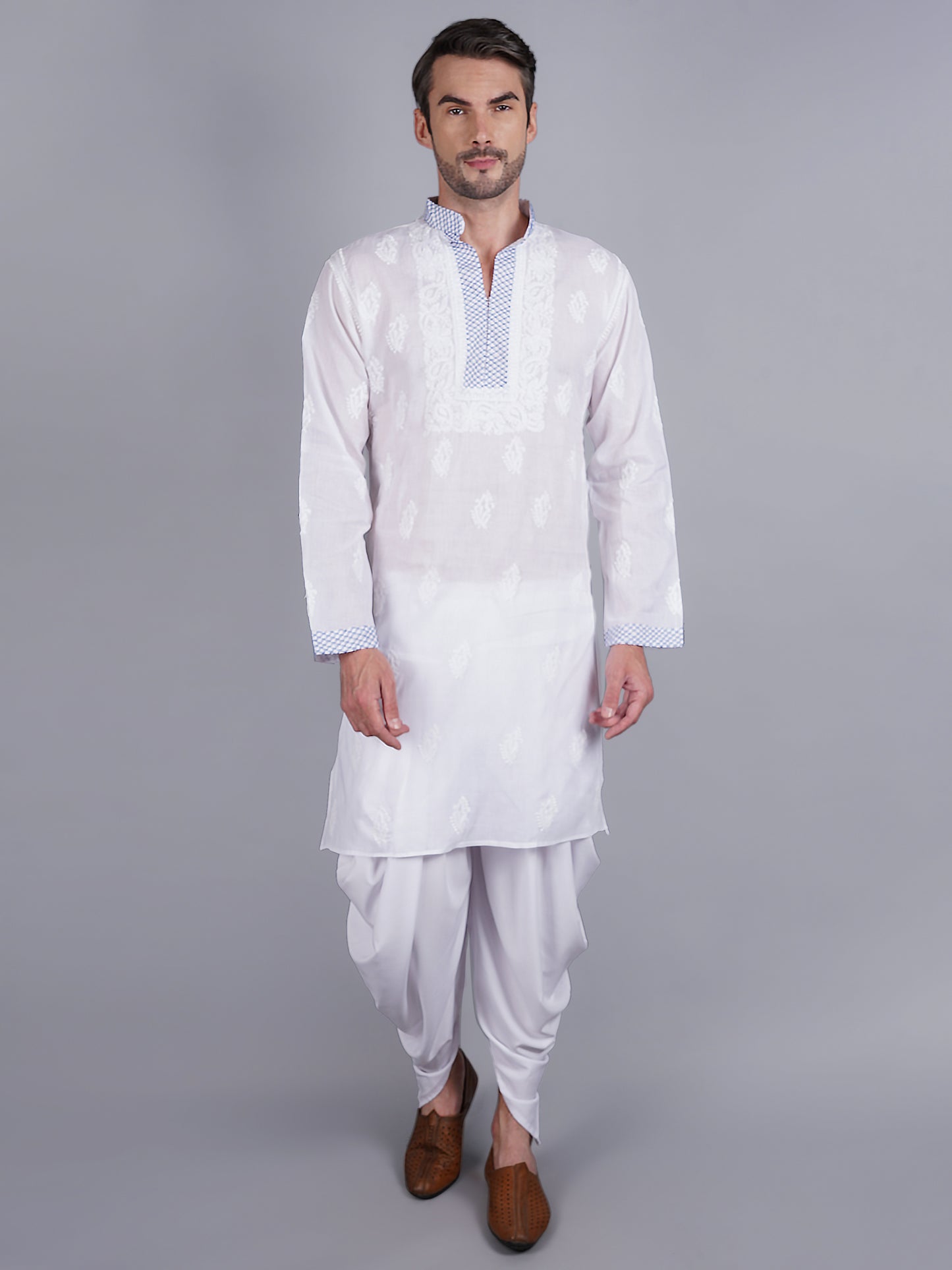Men White chikankari Kurta  made of pure white Linen, full length, button closure, blue thread work on placket, full sleeves, mandarin collar, side pockets, traditional wear for family occasions, casual wear